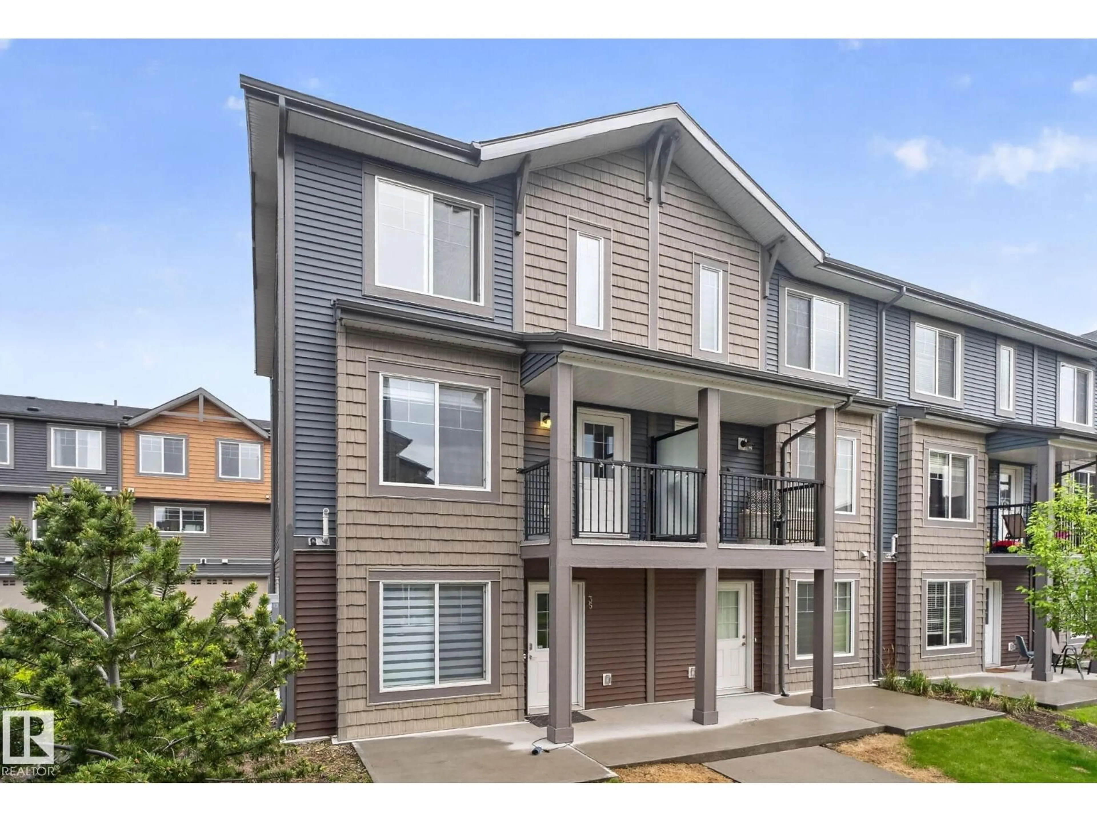 Home with vinyl exterior material, street for #35 - 3025 151 AV, Edmonton Alberta T5Y3W4