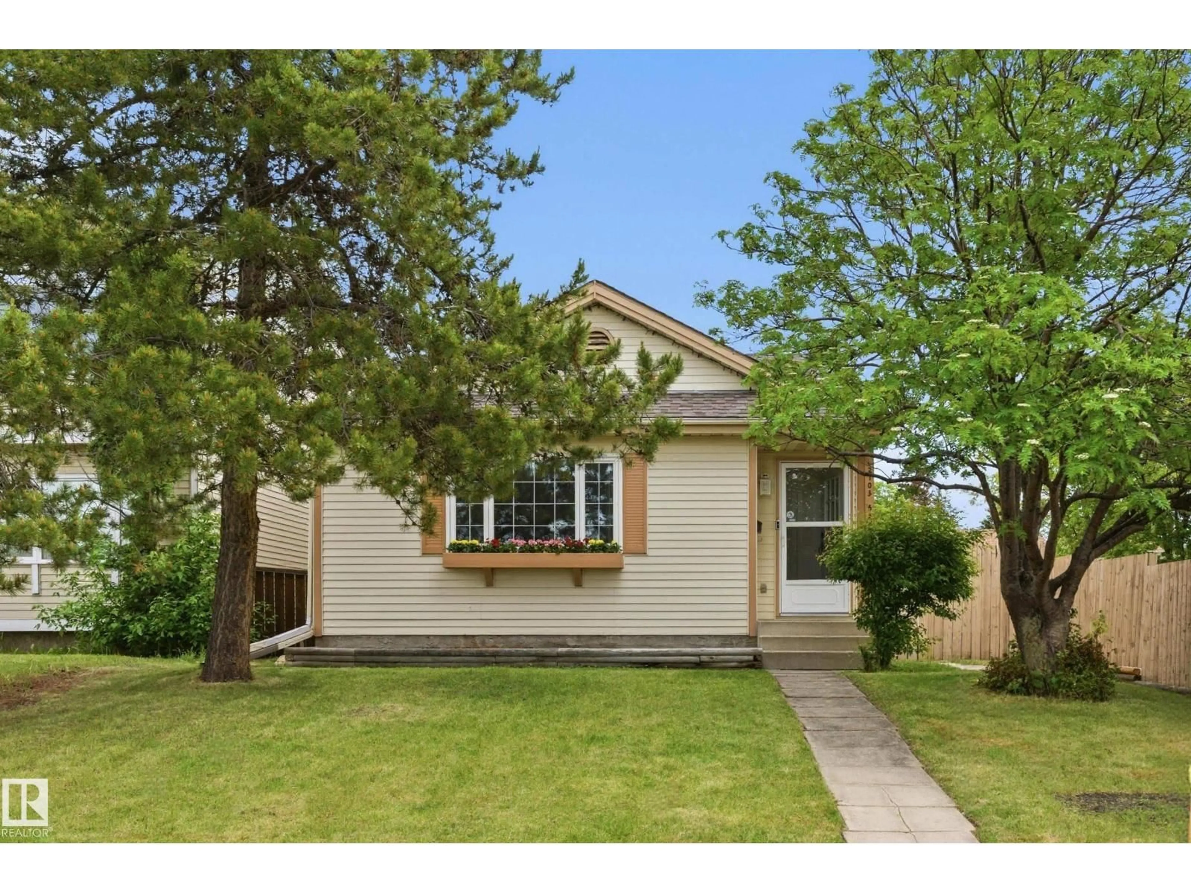Home with vinyl exterior material, street for 2103 53 ST, Edmonton Alberta T6L4T8