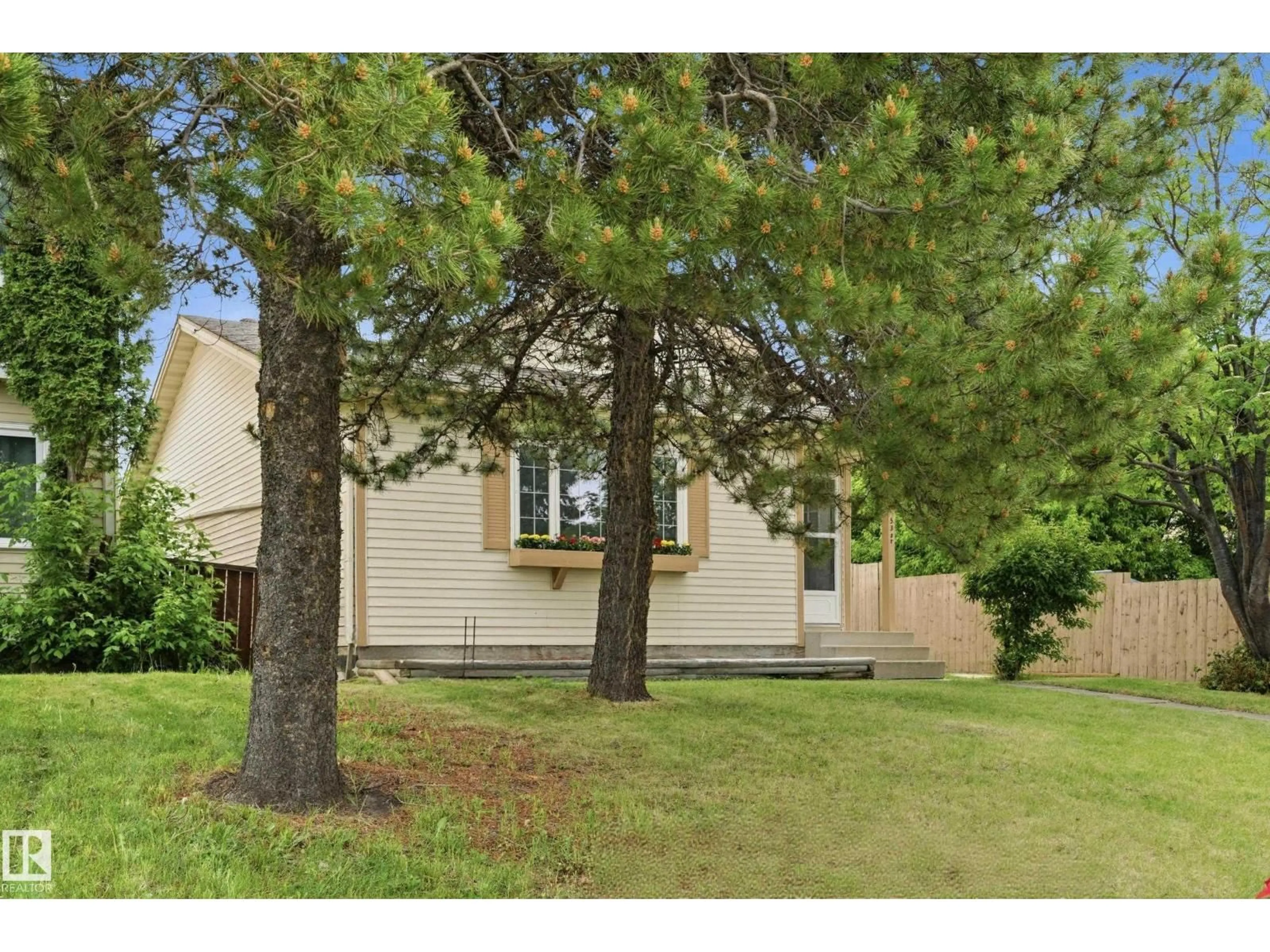 Home with vinyl exterior material, street for 2103 53 ST, Edmonton Alberta T6L4T8