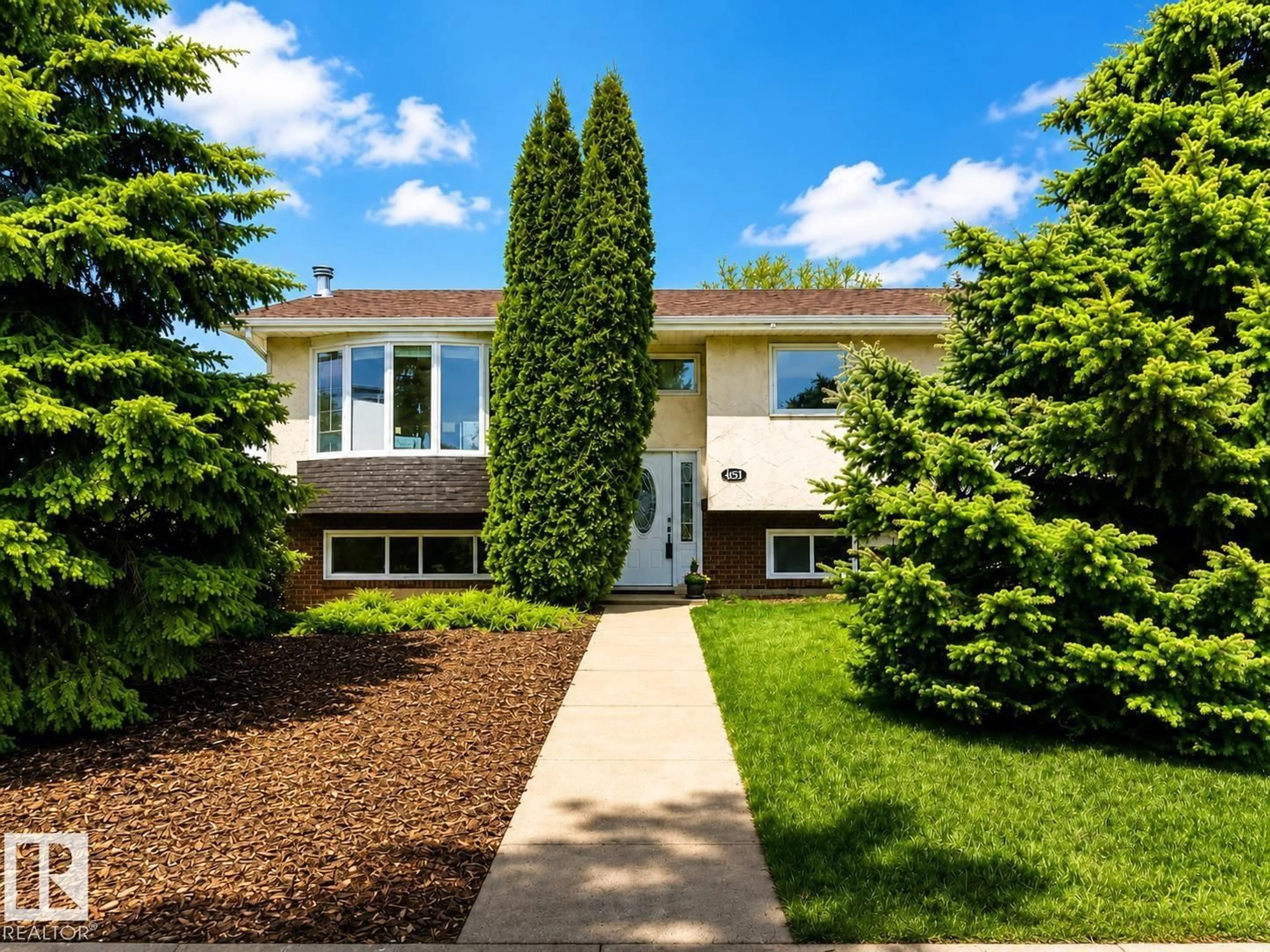 Home with vinyl exterior material, street for 9813 152 ST, Edmonton Alberta T5X1X2