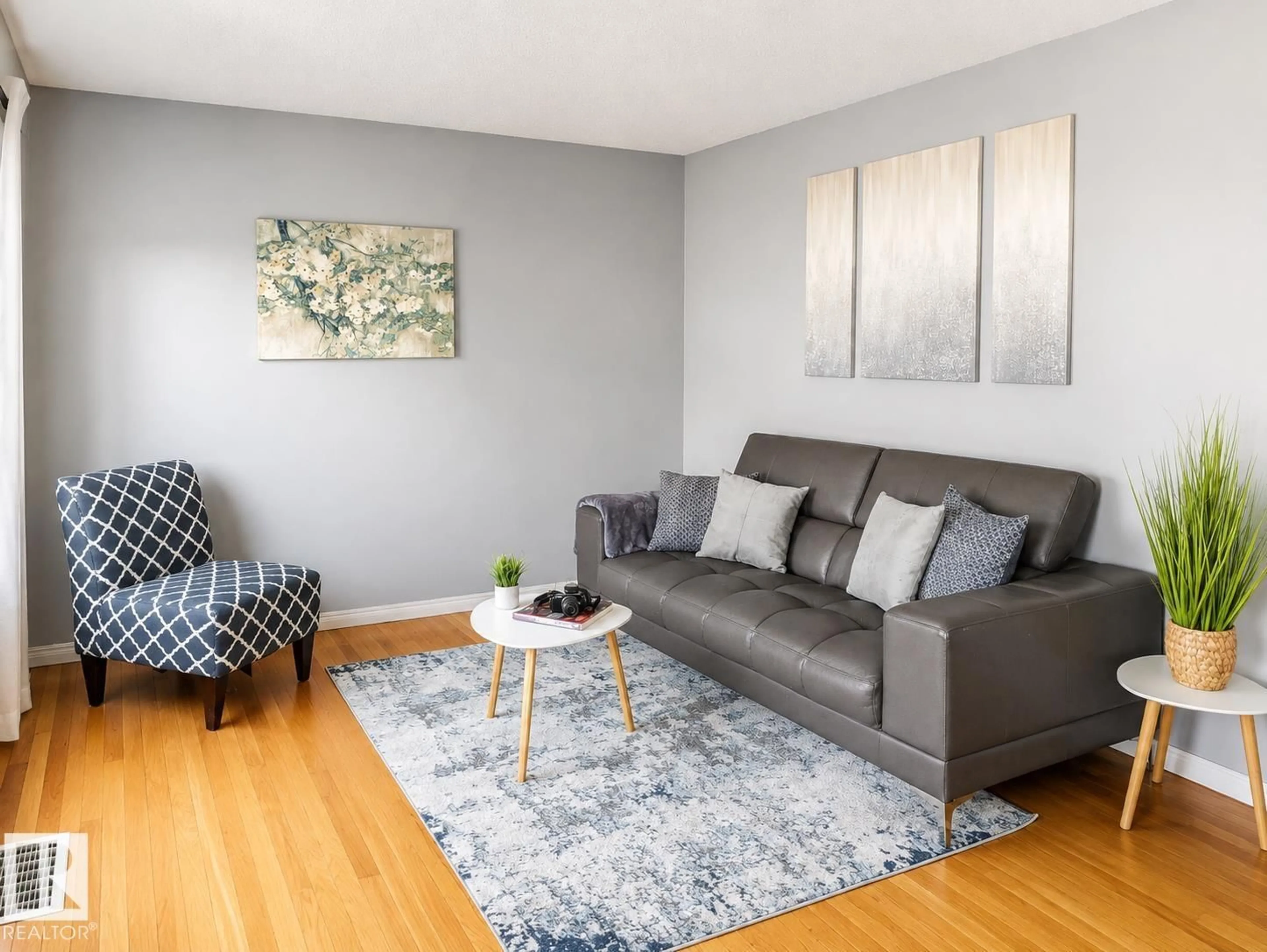 Living room with furniture, wood/laminate floor for NW - 10532 157 ST, Edmonton Alberta T5P2V8