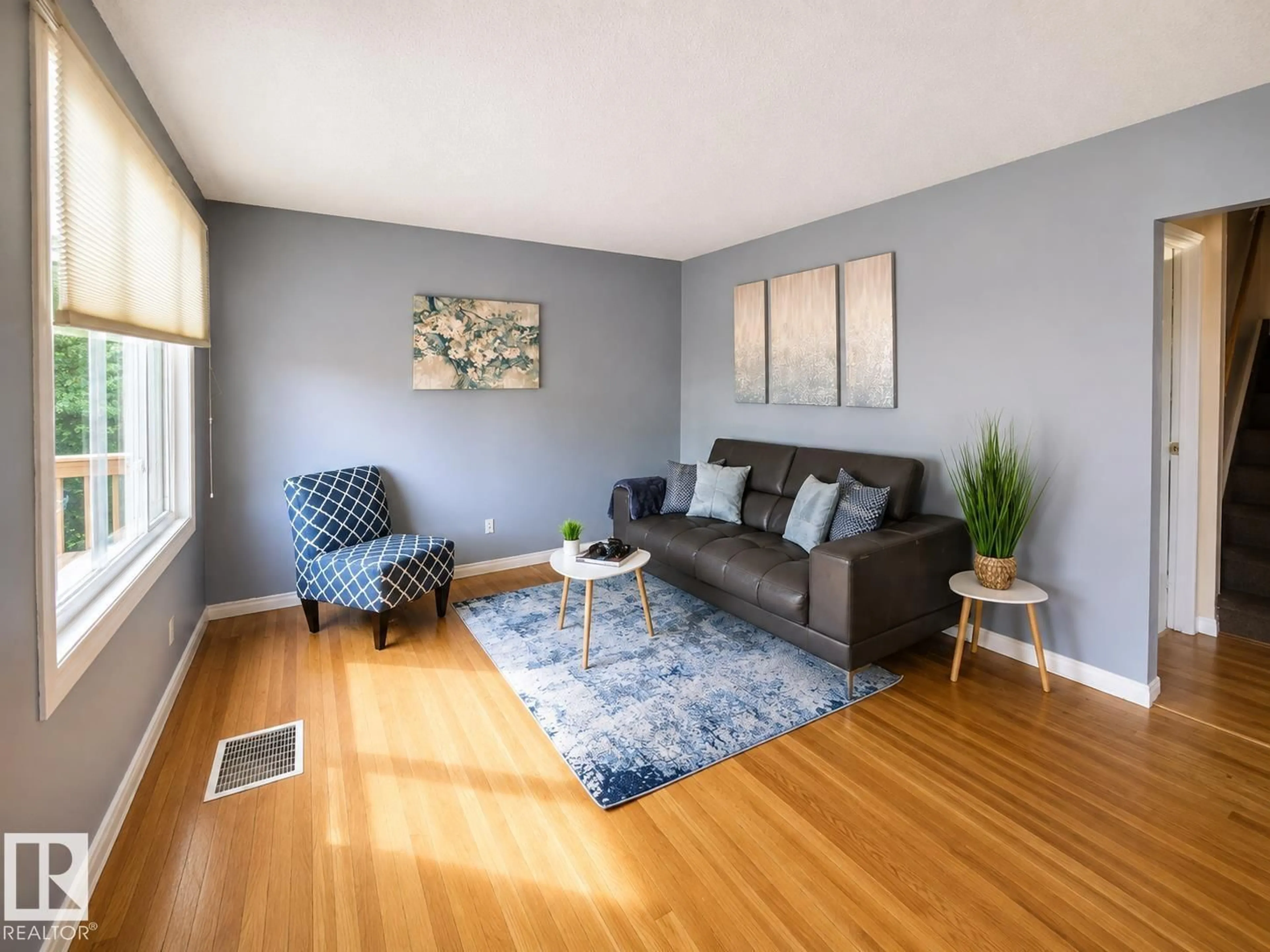 Living room with furniture, wood/laminate floor for NW - 10532 157 ST, Edmonton Alberta T5P2V8