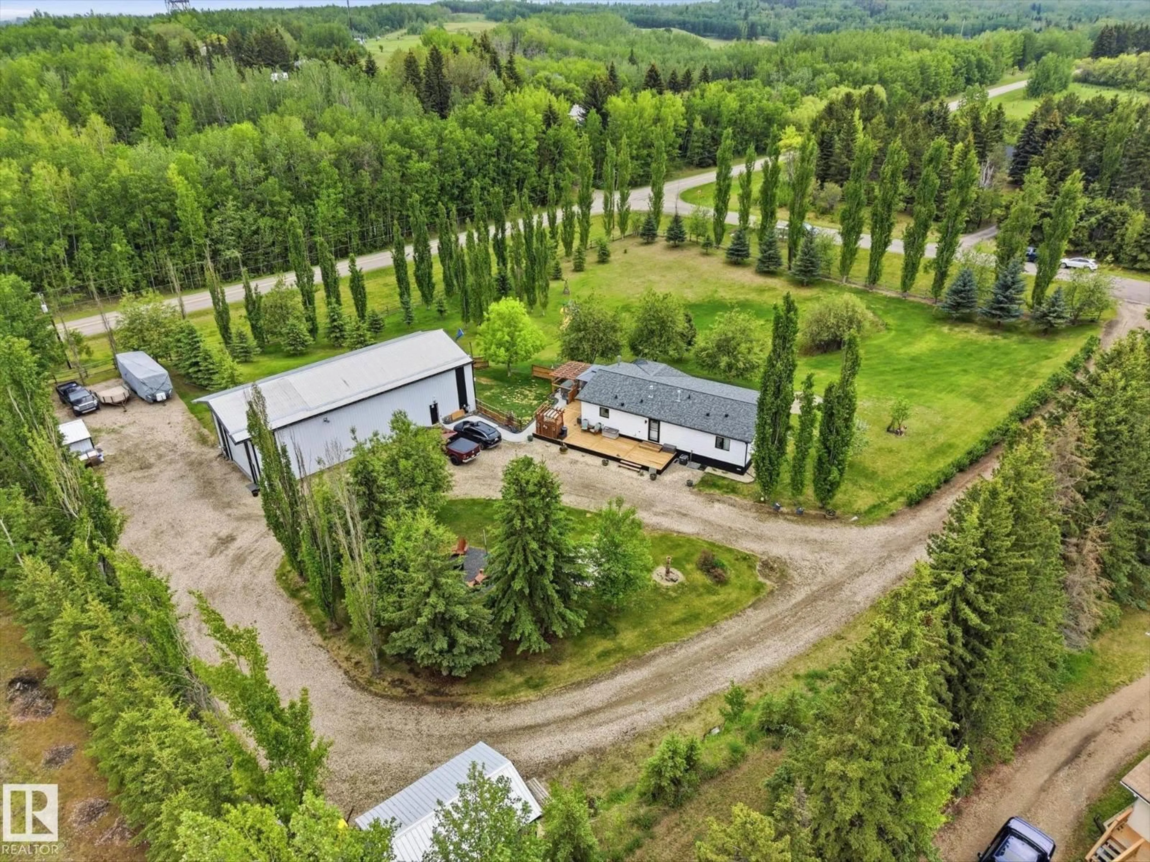 A pic from outside/outdoor area/front of a property/back of a property/a pic from drone, forest/trees view for 53112 - 44 RANGE ROAD 20, Rural Parkland County Alberta T7Y2G8