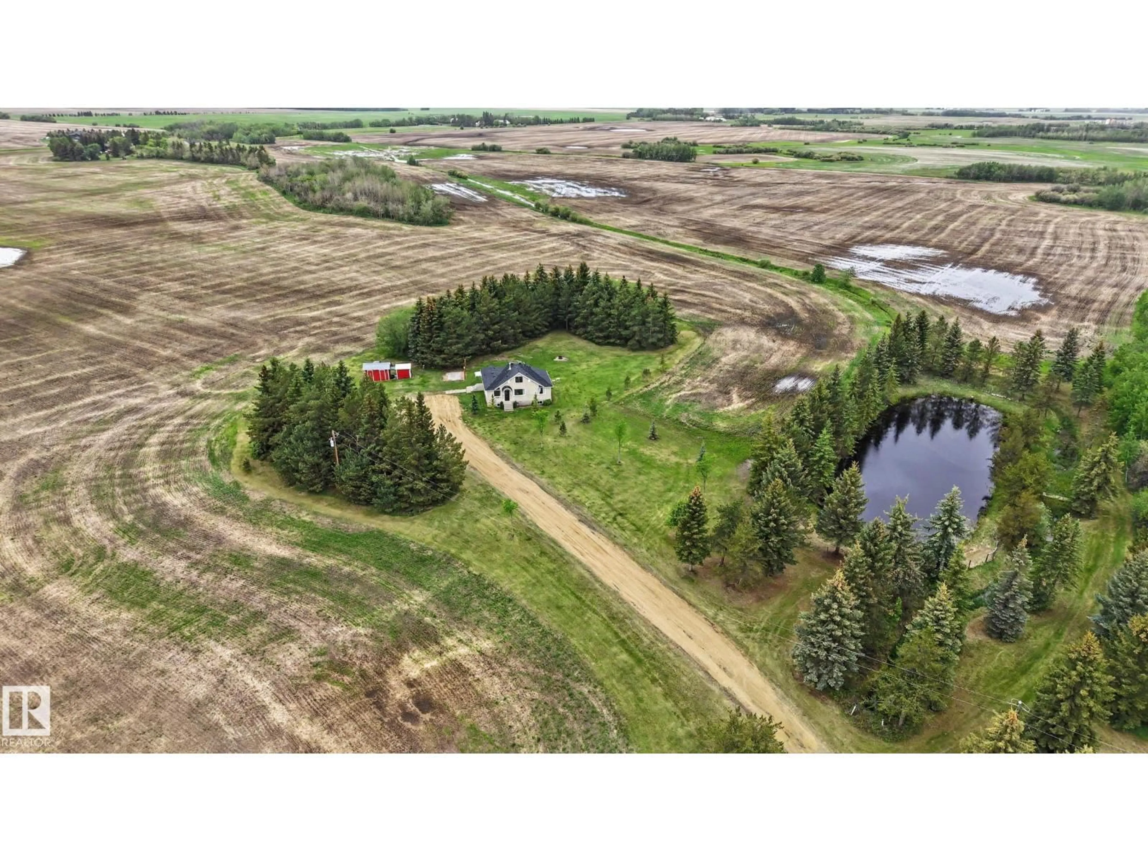 A pic from outside/outdoor area/front of a property/back of a property/a pic from drone, water/lake/river/ocean view for 25418 HWY 37, Rural Sturgeon County Alberta T8T2A3