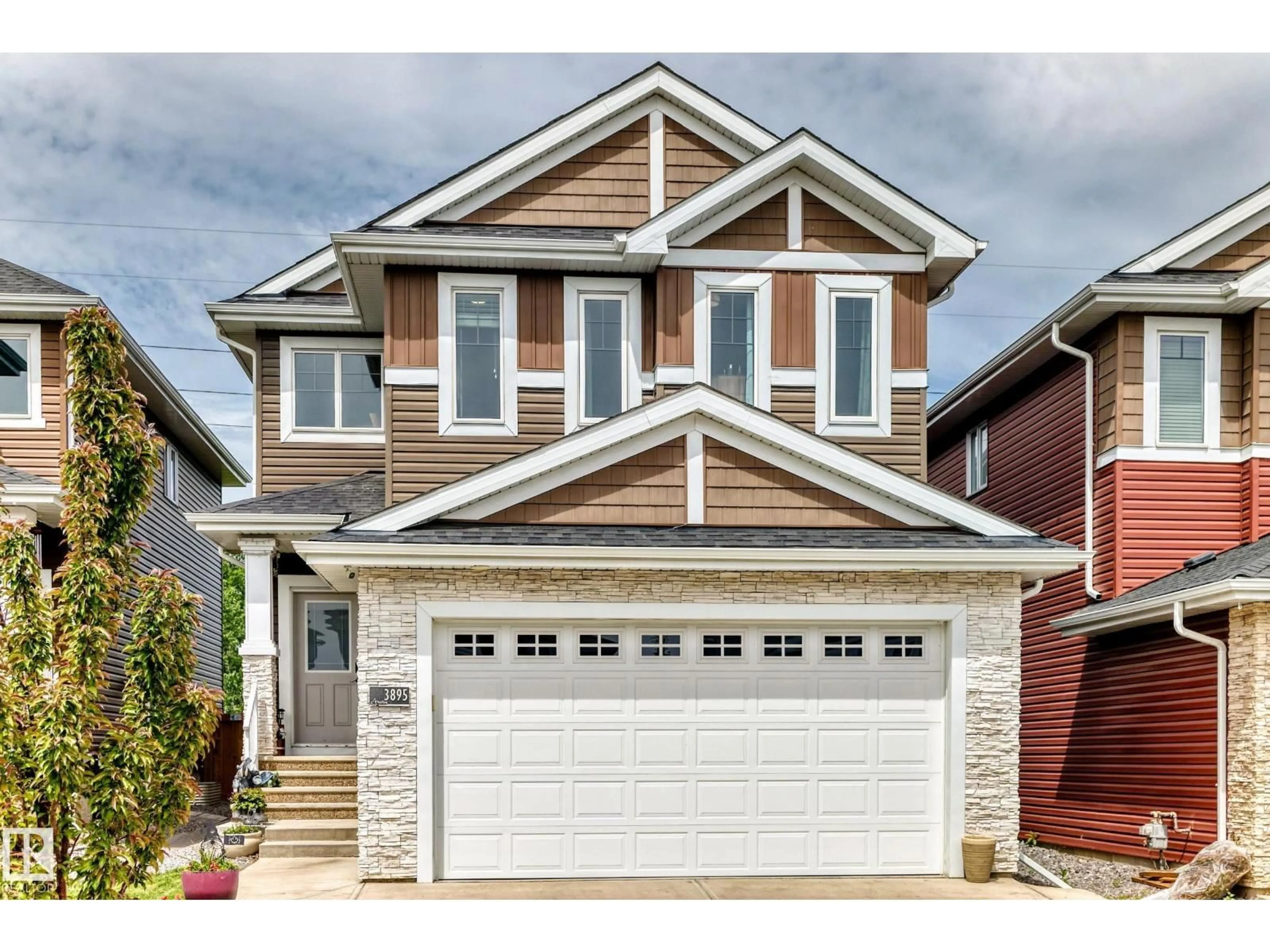 Home with vinyl exterior material, street for 3895 ROBINS CR, Edmonton Alberta T5S0M8