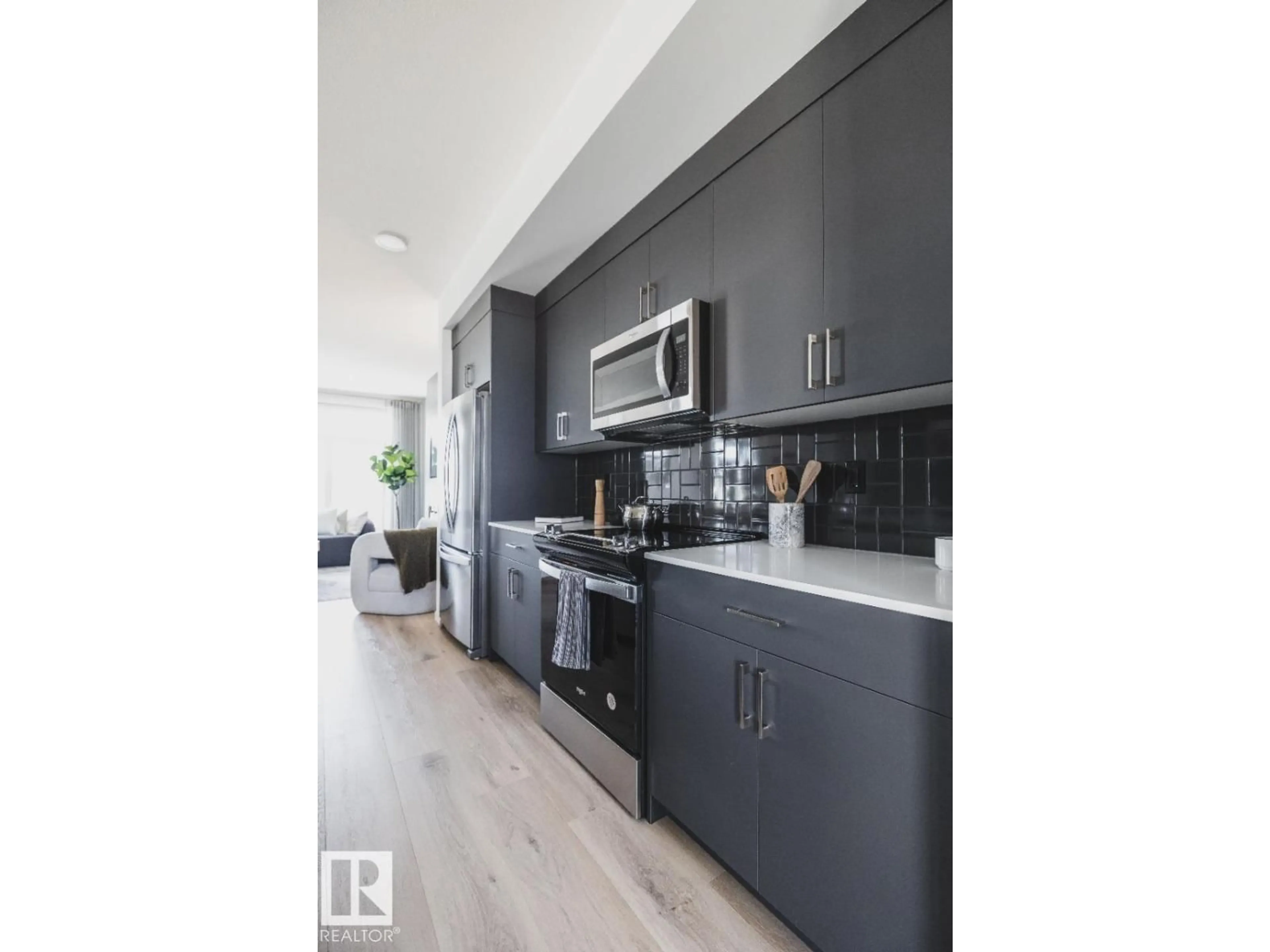 Open concept kitchen, wood/laminate floor for 347 RANKIN, St. Albert Alberta T8N8C7