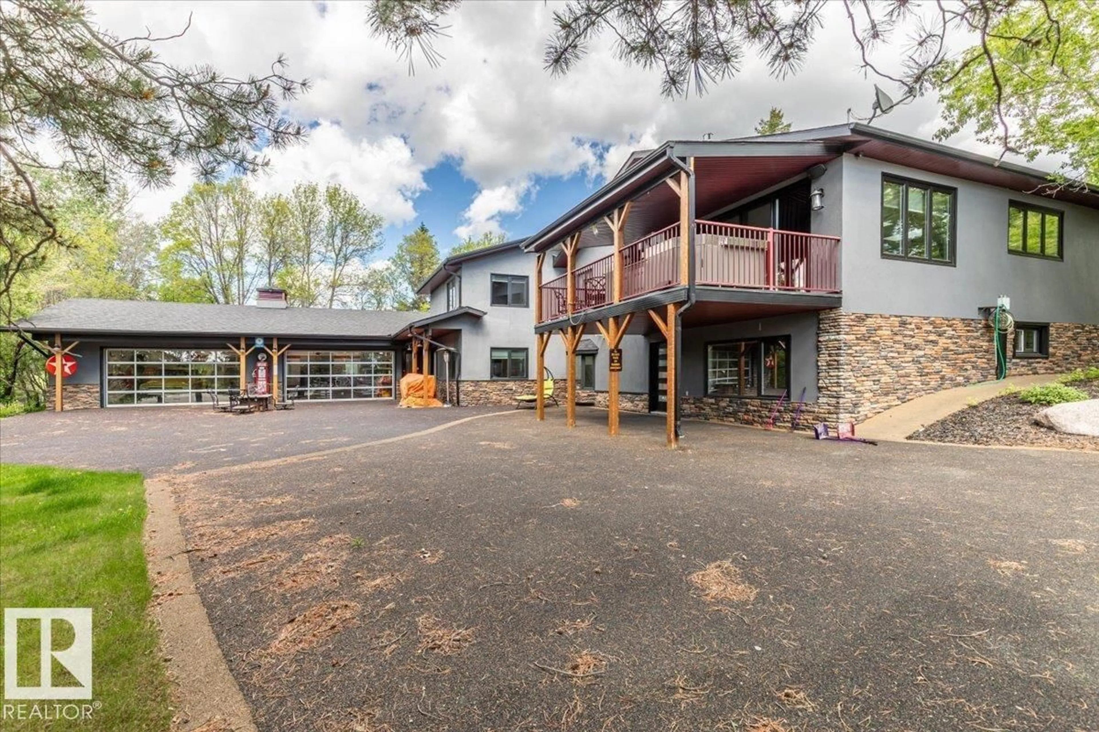 A pic from outside/outdoor area/front of a property/back of a property/a pic from drone, building for 15 - 25 53212 RGE ROAD, Rural Parkland County Alberta T7Y0C3