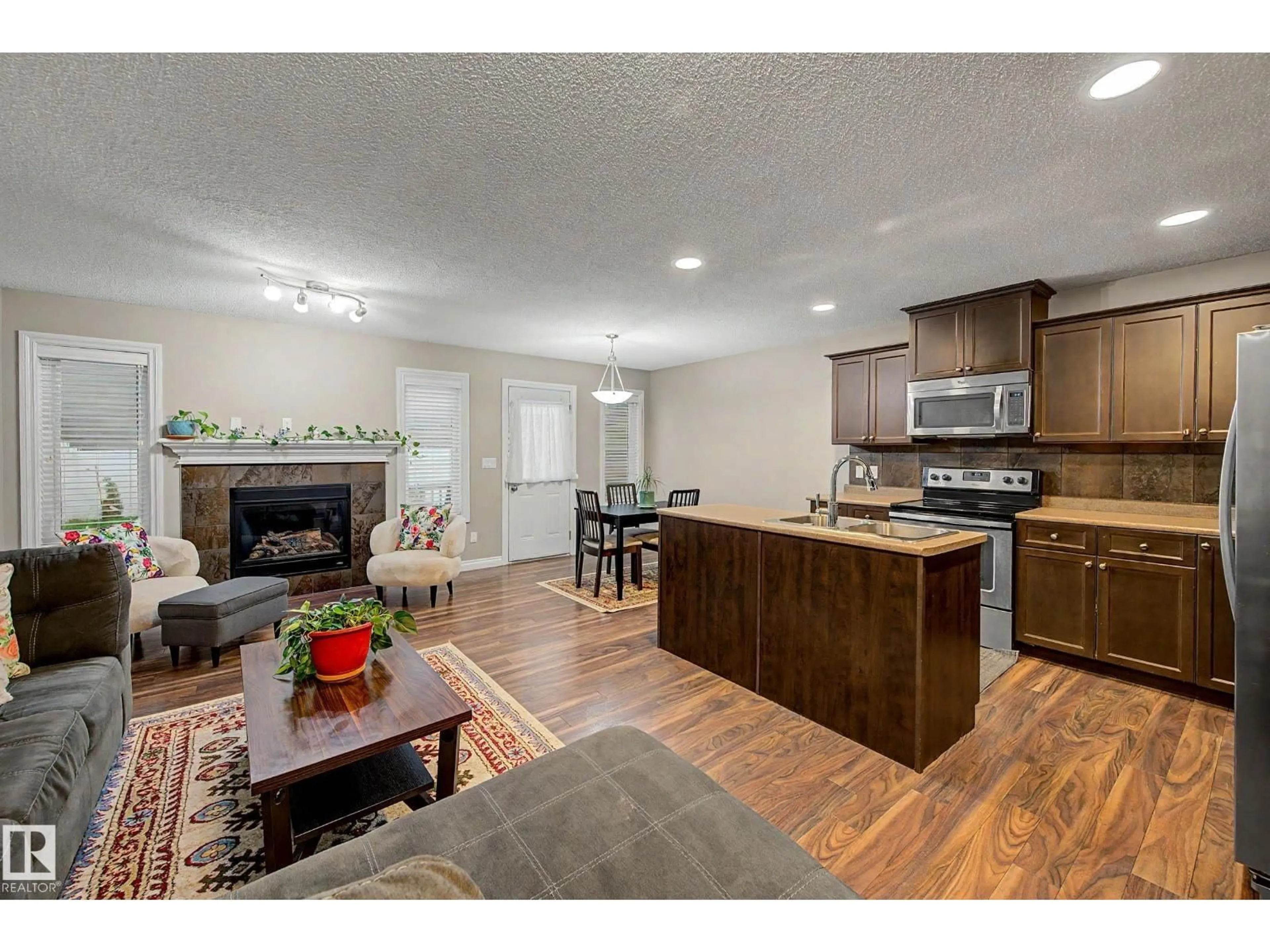 Open concept kitchen, wood/laminate floor for NW - 5110 168A AV, Edmonton Alberta T5Y0R9