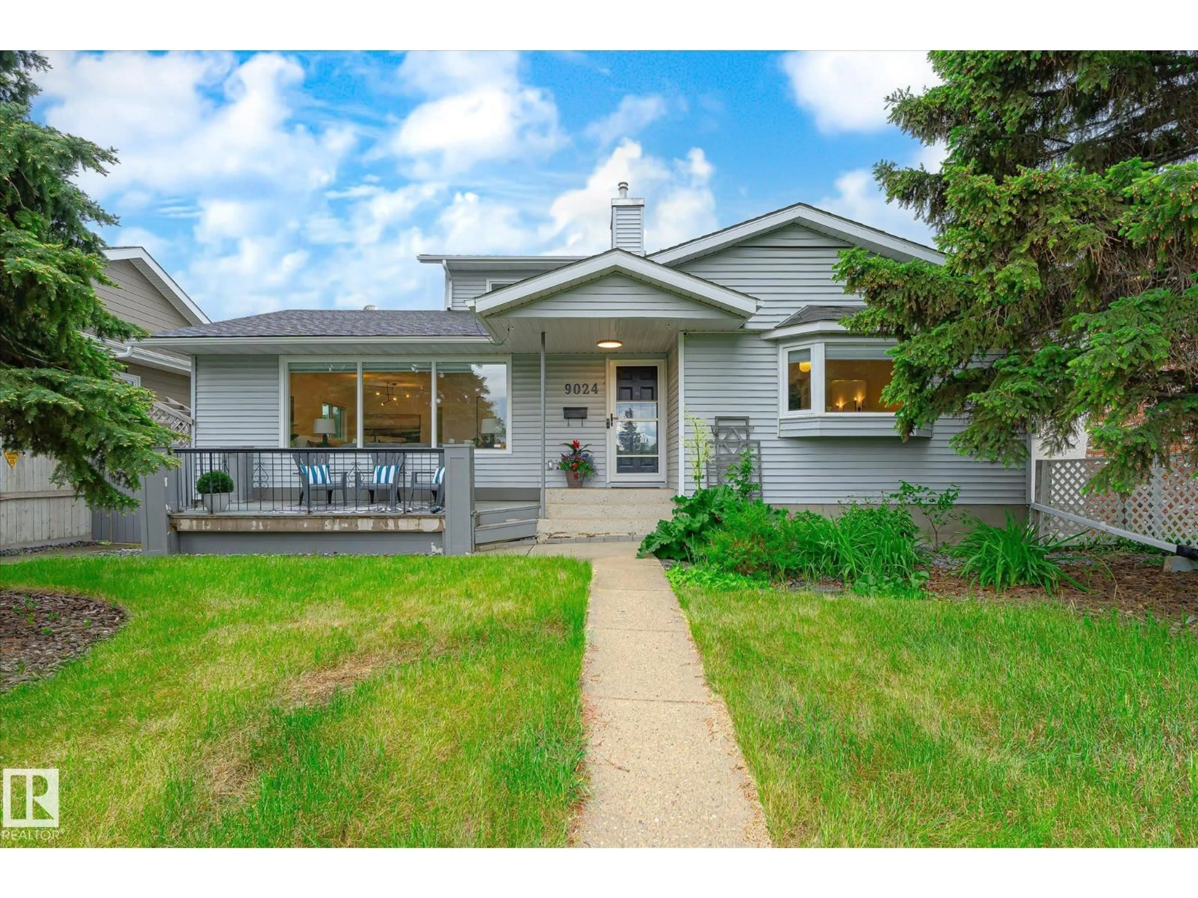 Home with vinyl exterior material, street for 9024 147 ST, Edmonton Alberta T5R0Y5