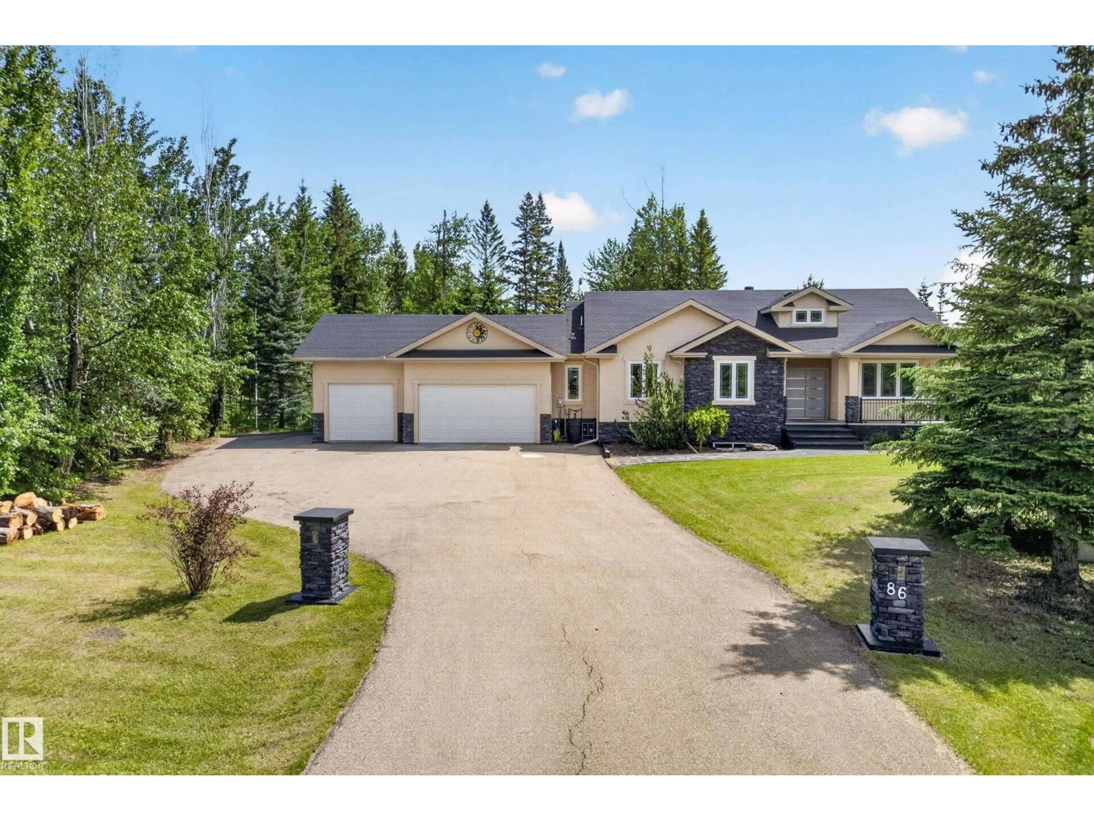 A pic from outside/outdoor area/front of a property/back of a property/a pic from drone, street for 86 53305 RGE ROAD 273, Rural Parkland County Alberta T7X3N3