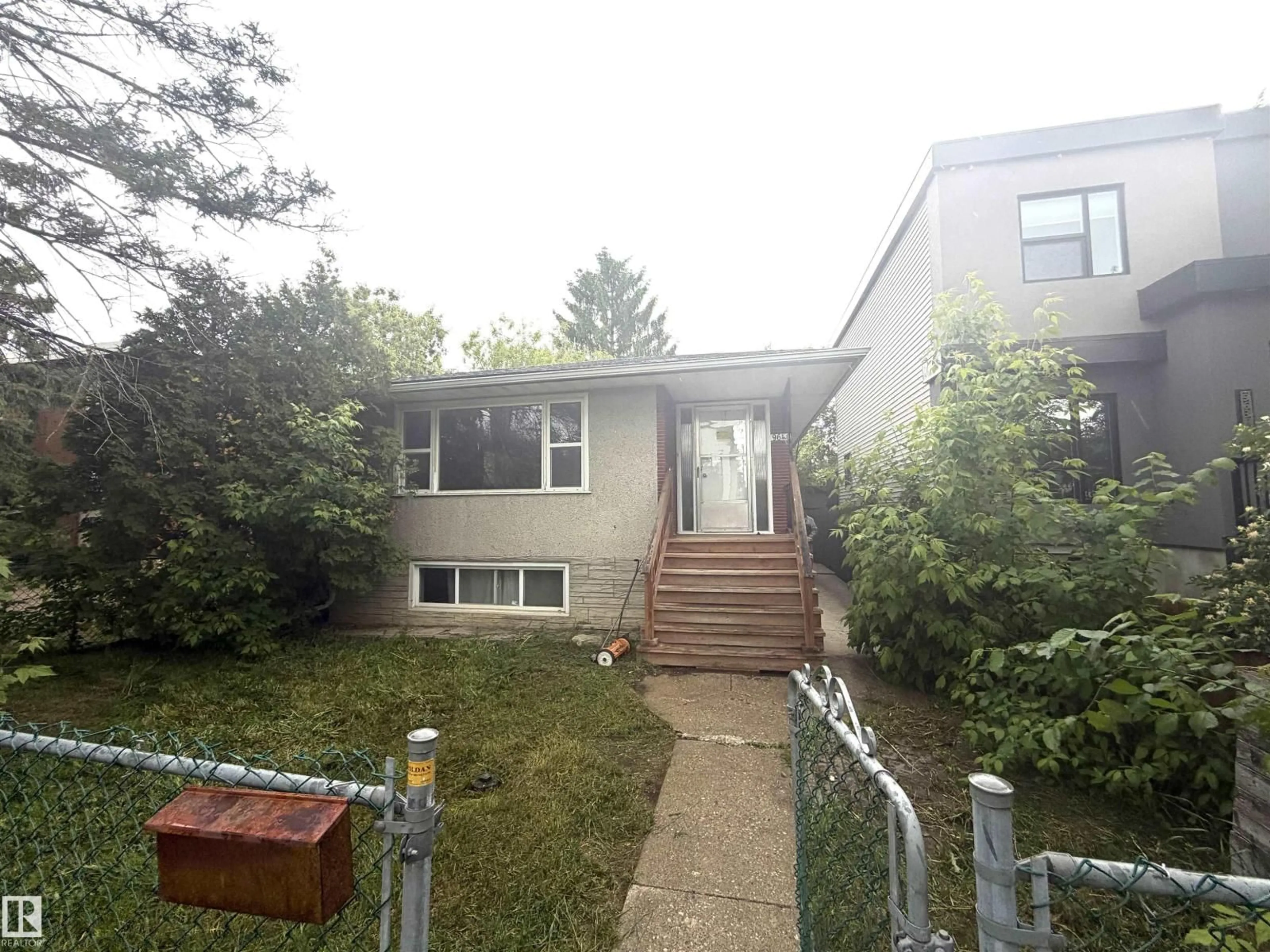 Home with vinyl exterior material, street for 9640 74 AV, Edmonton Alberta T6E1E6