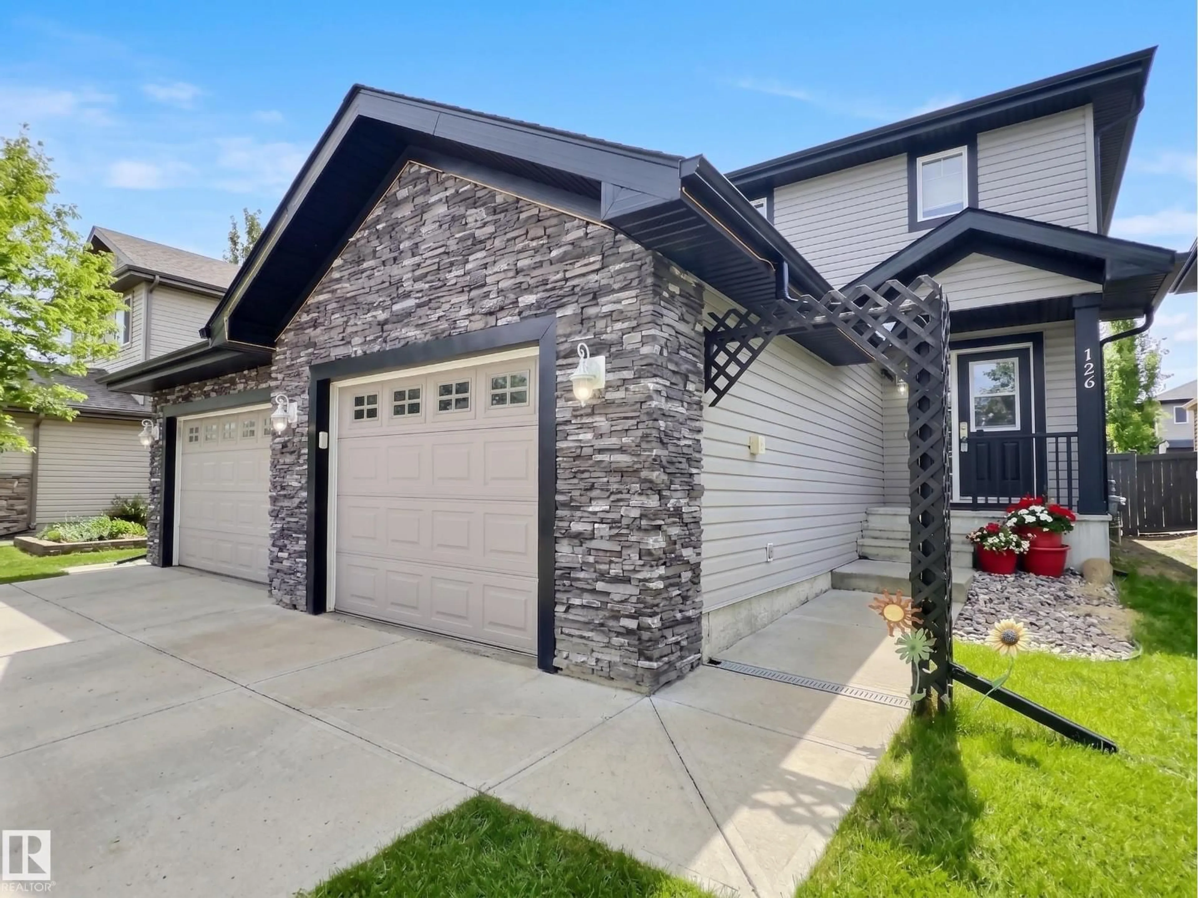 Home with brick exterior material, street for 126 CALVERT WD, Fort Saskatchewan Alberta T8L0C4