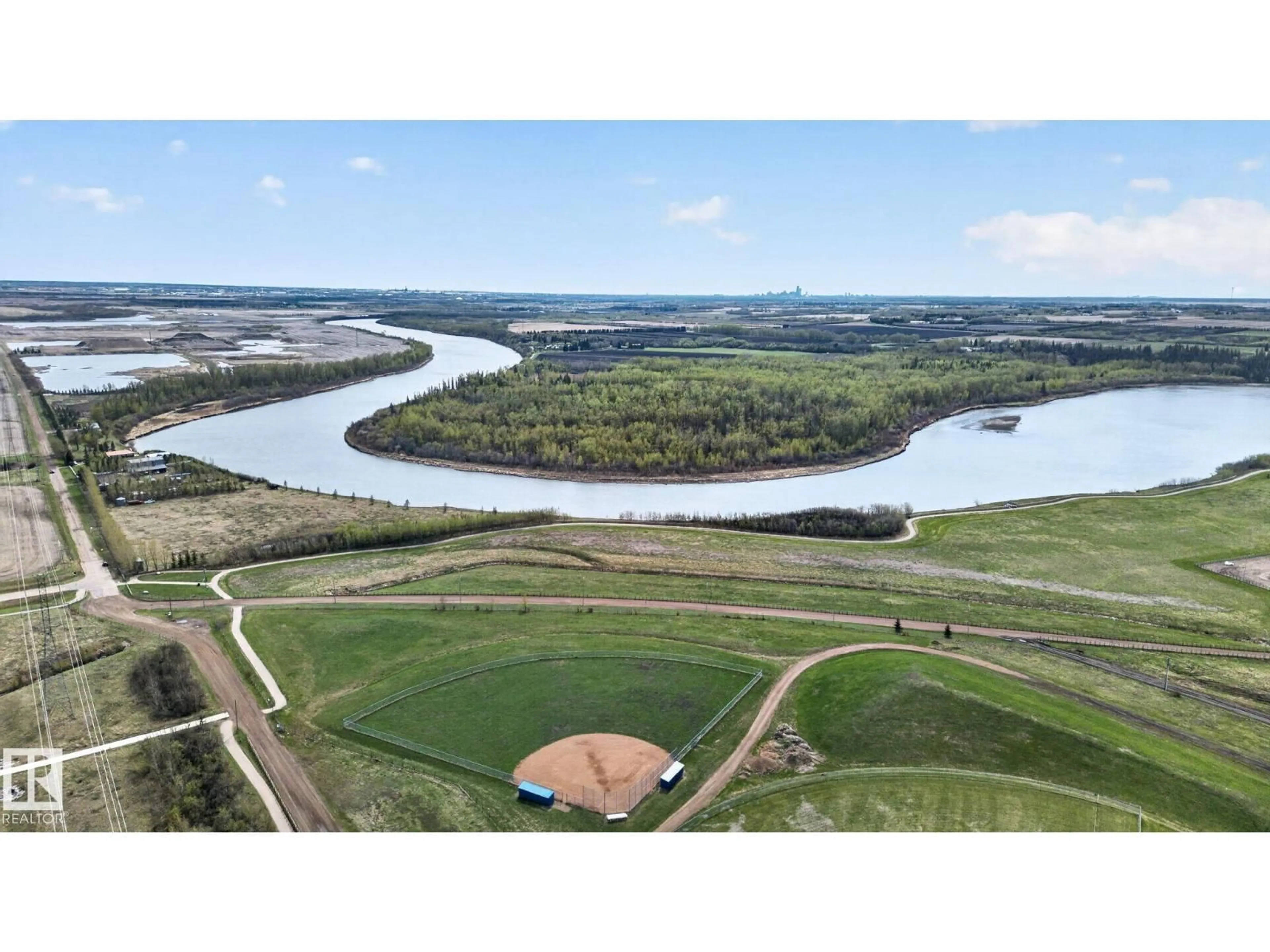 A pic from outside/outdoor area/front of a property/back of a property/a pic from drone, water/lake/river/ocean view for 105 WYATT RG, Fort Saskatchewan Alberta T8L0Y3