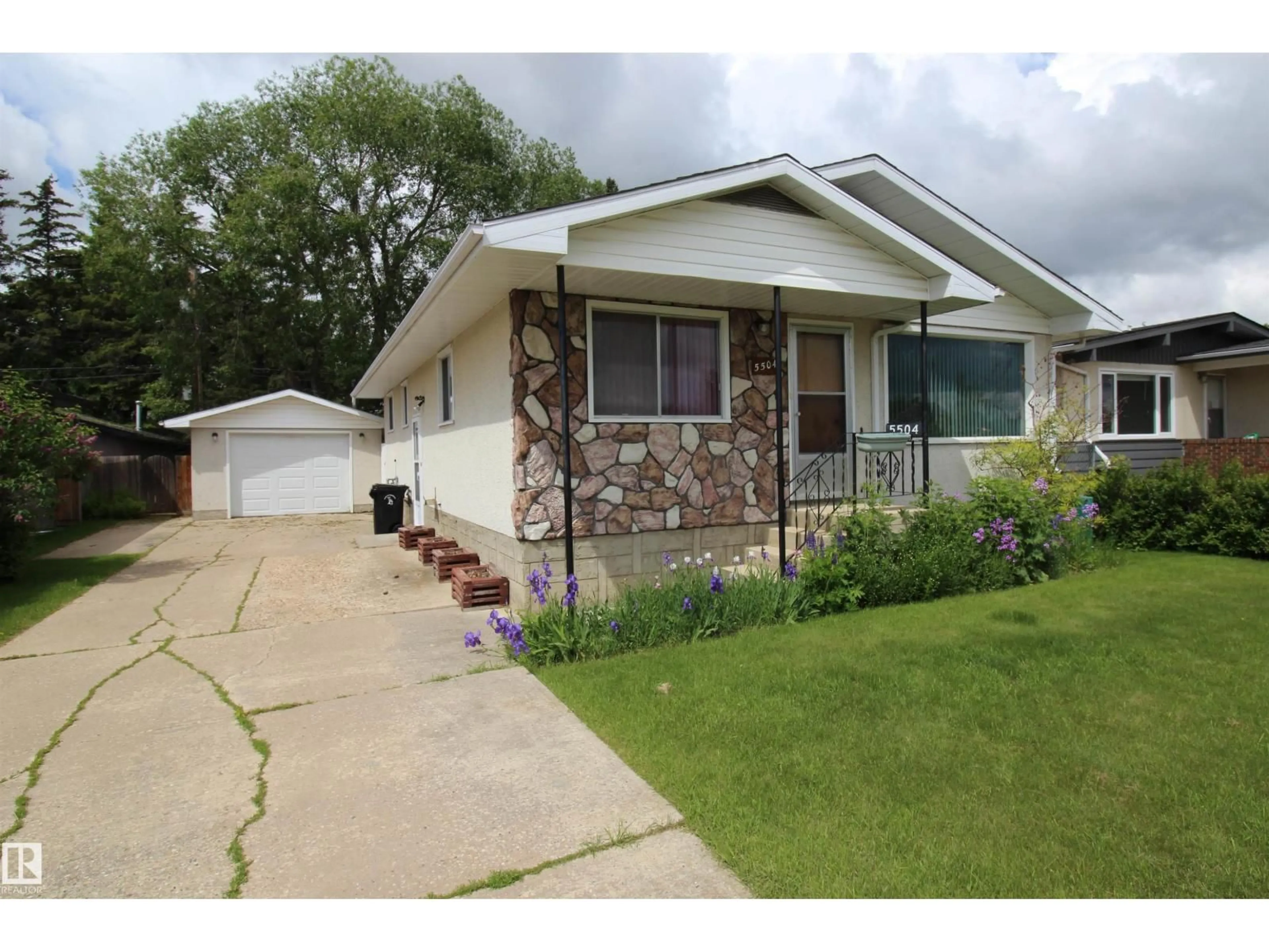Home with vinyl exterior material, street for 5504 56, Barrhead Alberta T7N0A1