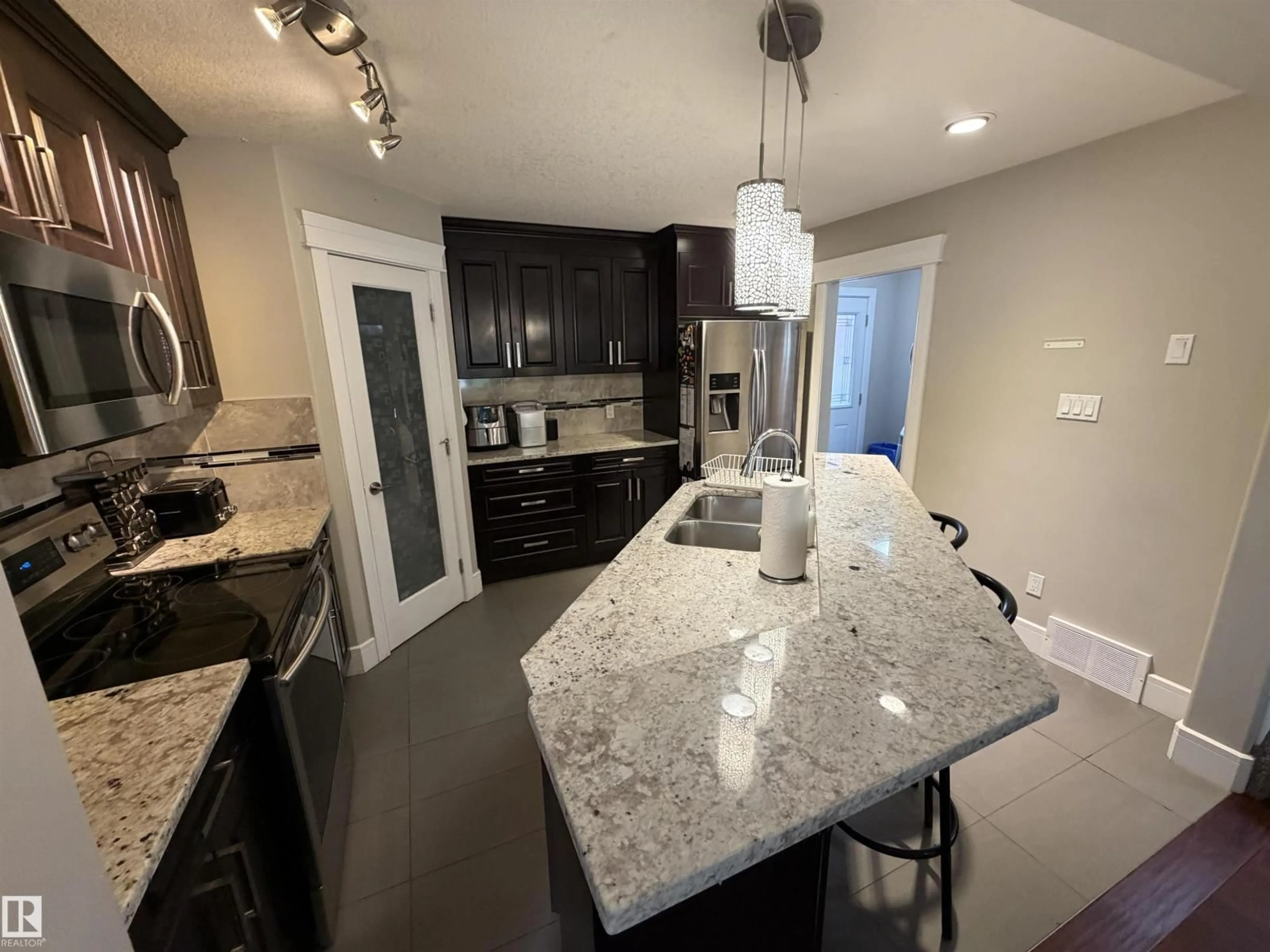 Open concept kitchen, ceramic/tile floor for 10914 71 AV, Edmonton Alberta T6G0A1