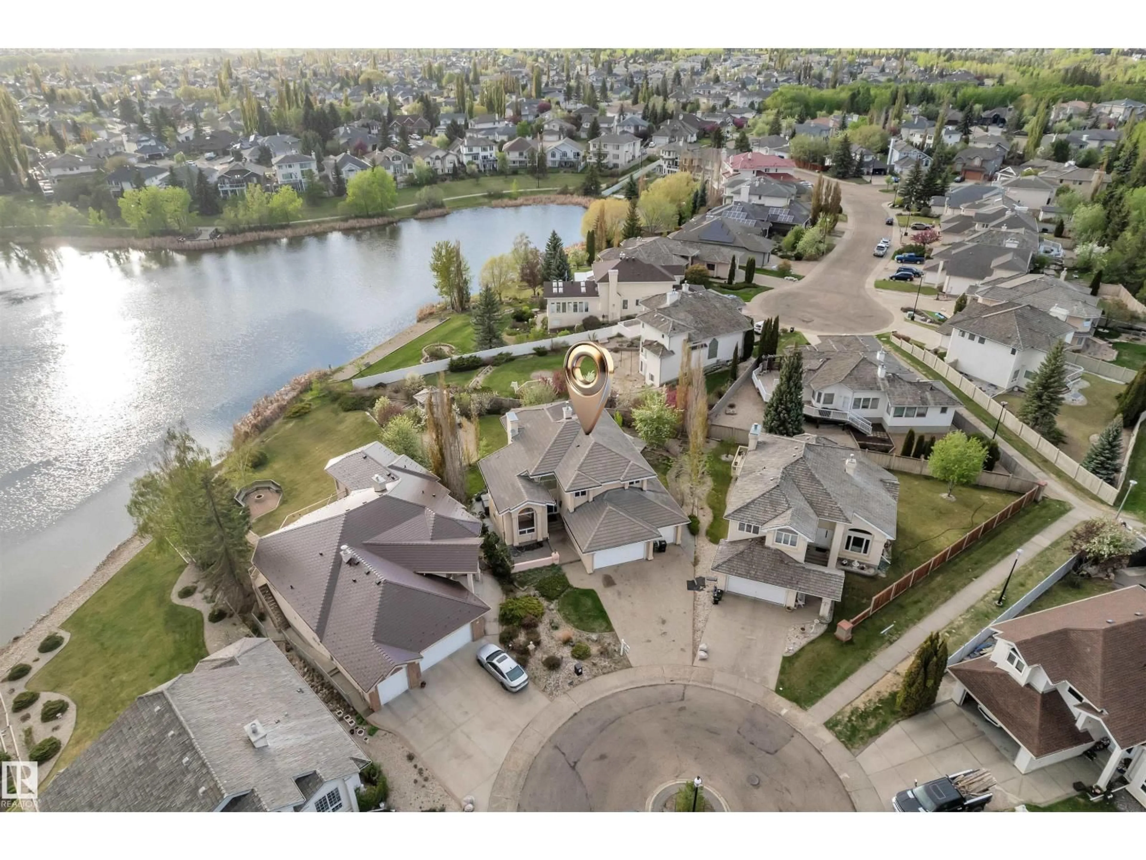 A pic from outside/outdoor area/front of a property/back of a property/a pic from drone, water/lake/river/ocean view for 106 TWIN BROOKS CV, Edmonton Alberta T6J6T1