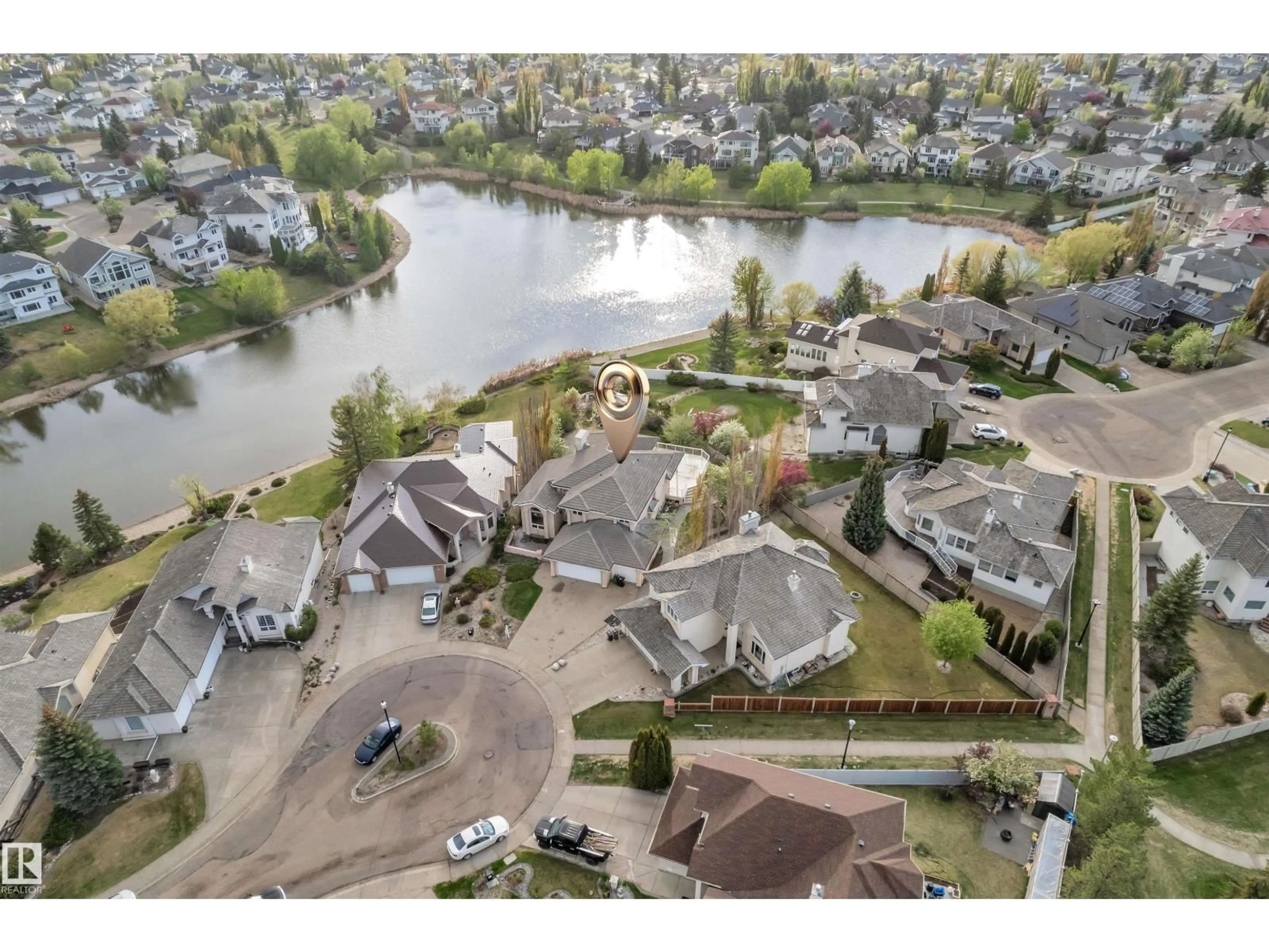 A pic from outside/outdoor area/front of a property/back of a property/a pic from drone, water/lake/river/ocean view for 106 TWIN BROOKS CV, Edmonton Alberta T6J6T1