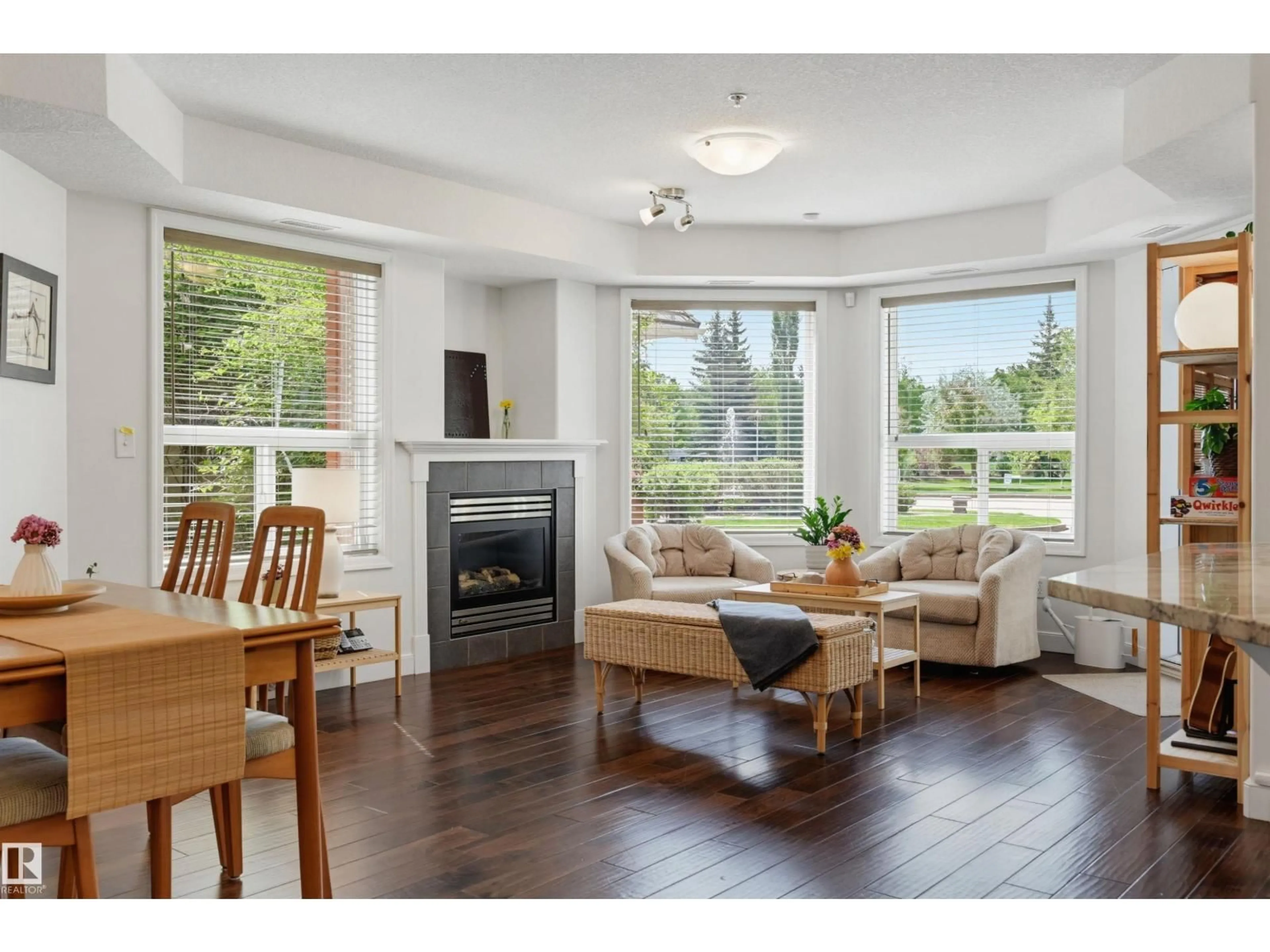 Living room with furniture, wood/laminate floor for #139 - 9008 99 AV, Edmonton Alberta T5H4M6