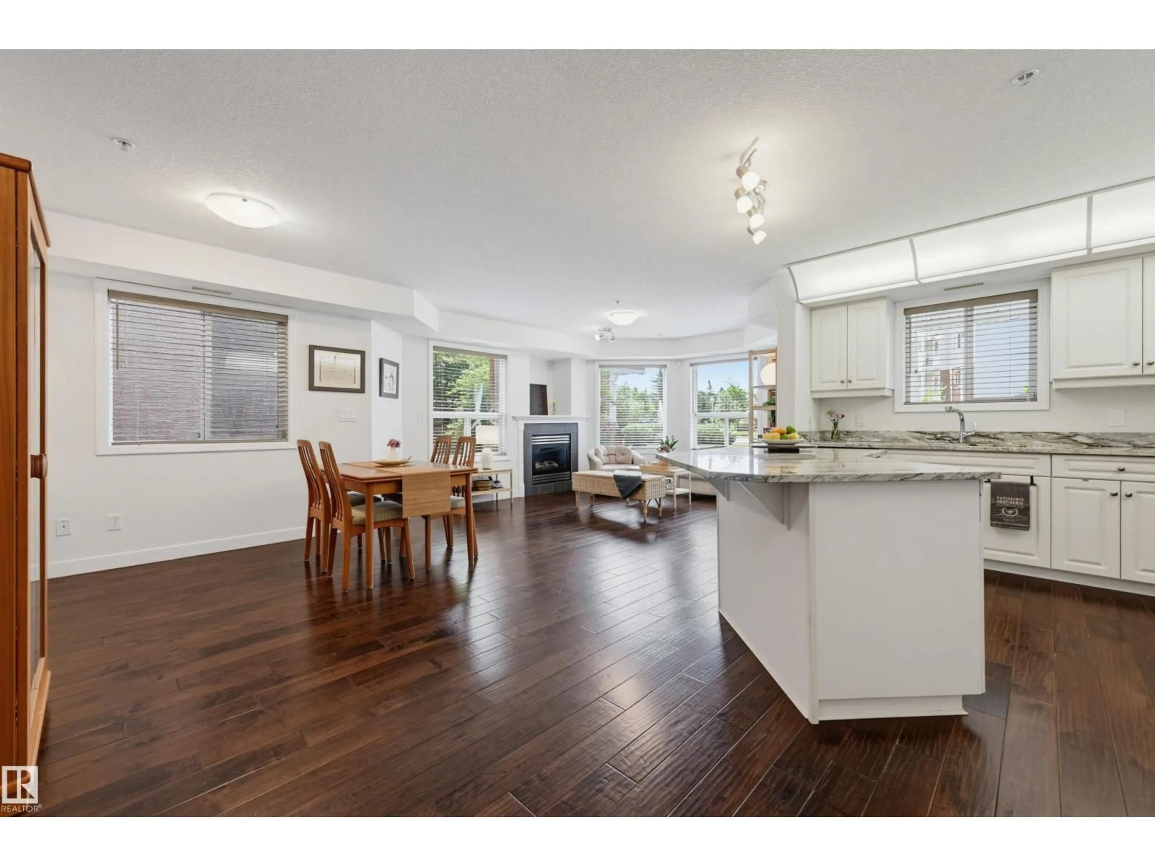 Open concept kitchen, wood/laminate floor for #139 - 9008 99 AV, Edmonton Alberta T5H4M6