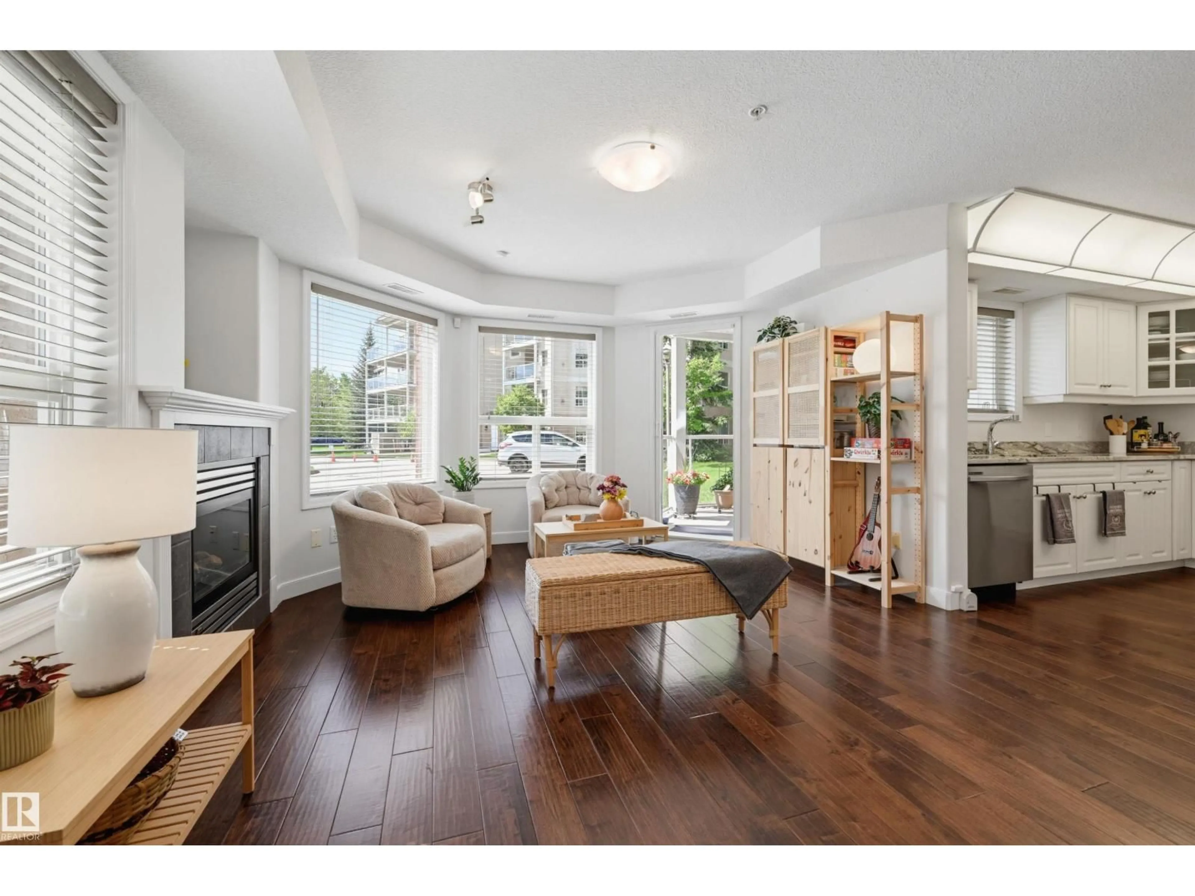 Living room with furniture, wood/laminate floor for #139 - 9008 99 AV, Edmonton Alberta T5H4M6