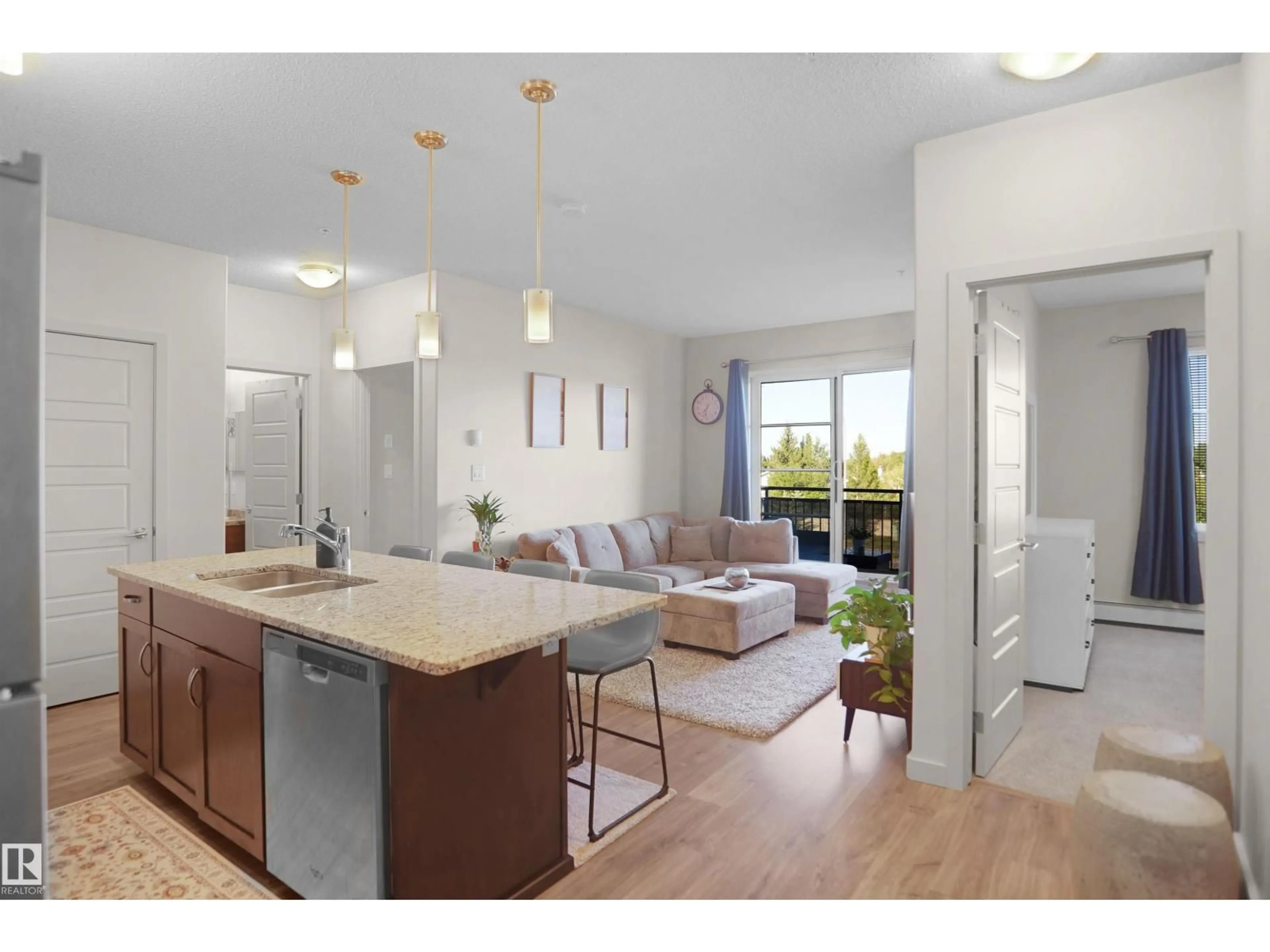 Open concept kitchen, wood/laminate floor for 318 - 1004 ROSENTHAL BV, Edmonton Alberta T5T7C6