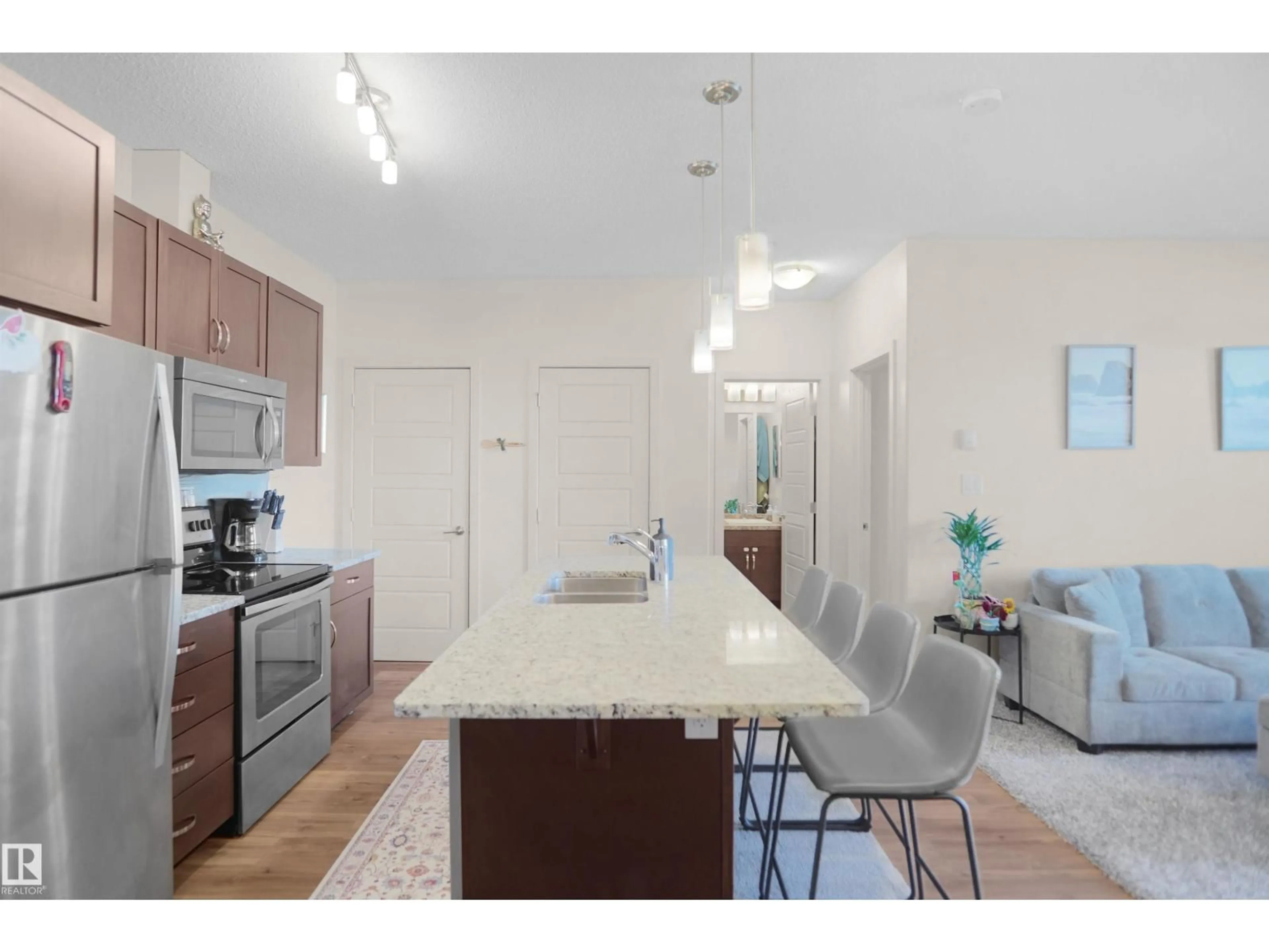 Open concept kitchen, unknown for 318 - 1004 ROSENTHAL BV, Edmonton Alberta T5T7C6