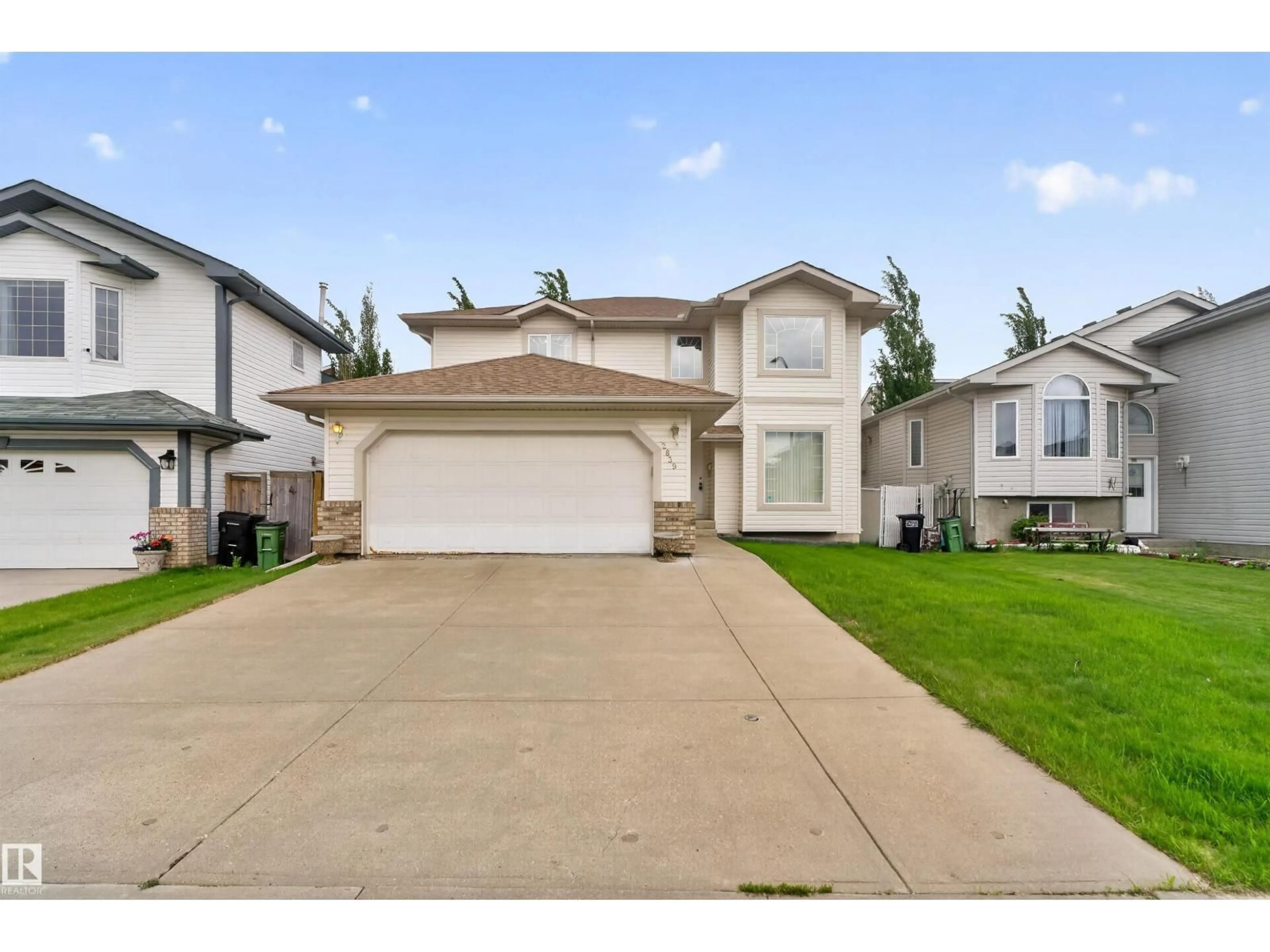 Home with vinyl exterior material, street for 2839 151A AV, Edmonton Alberta T5Y2T7