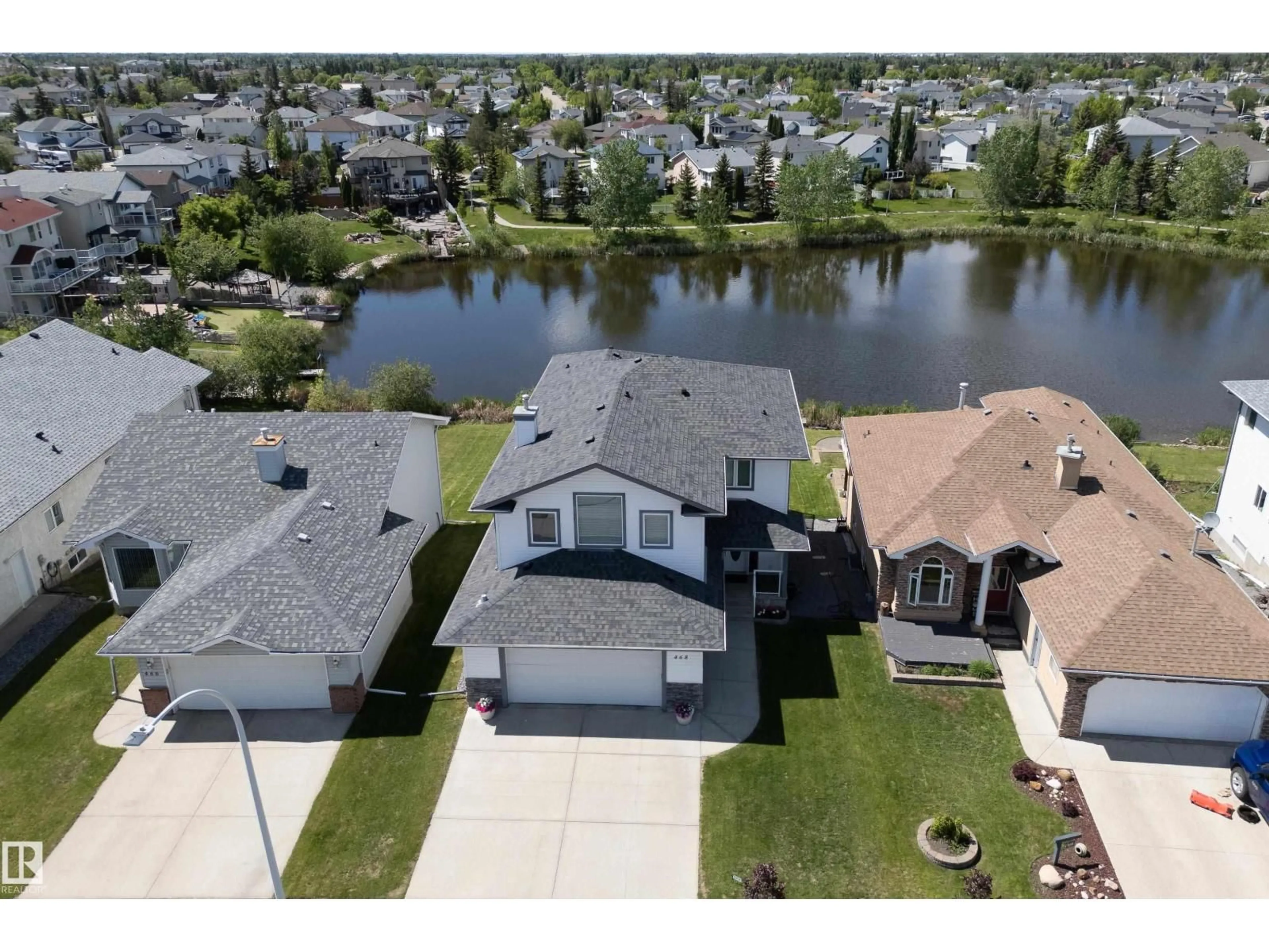 A pic from outside/outdoor area/front of a property/back of a property/a pic from drone, water/lake/river/ocean view for NW - 468 KLARVATTEN LAKE WD, Edmonton Alberta T5Z3C2