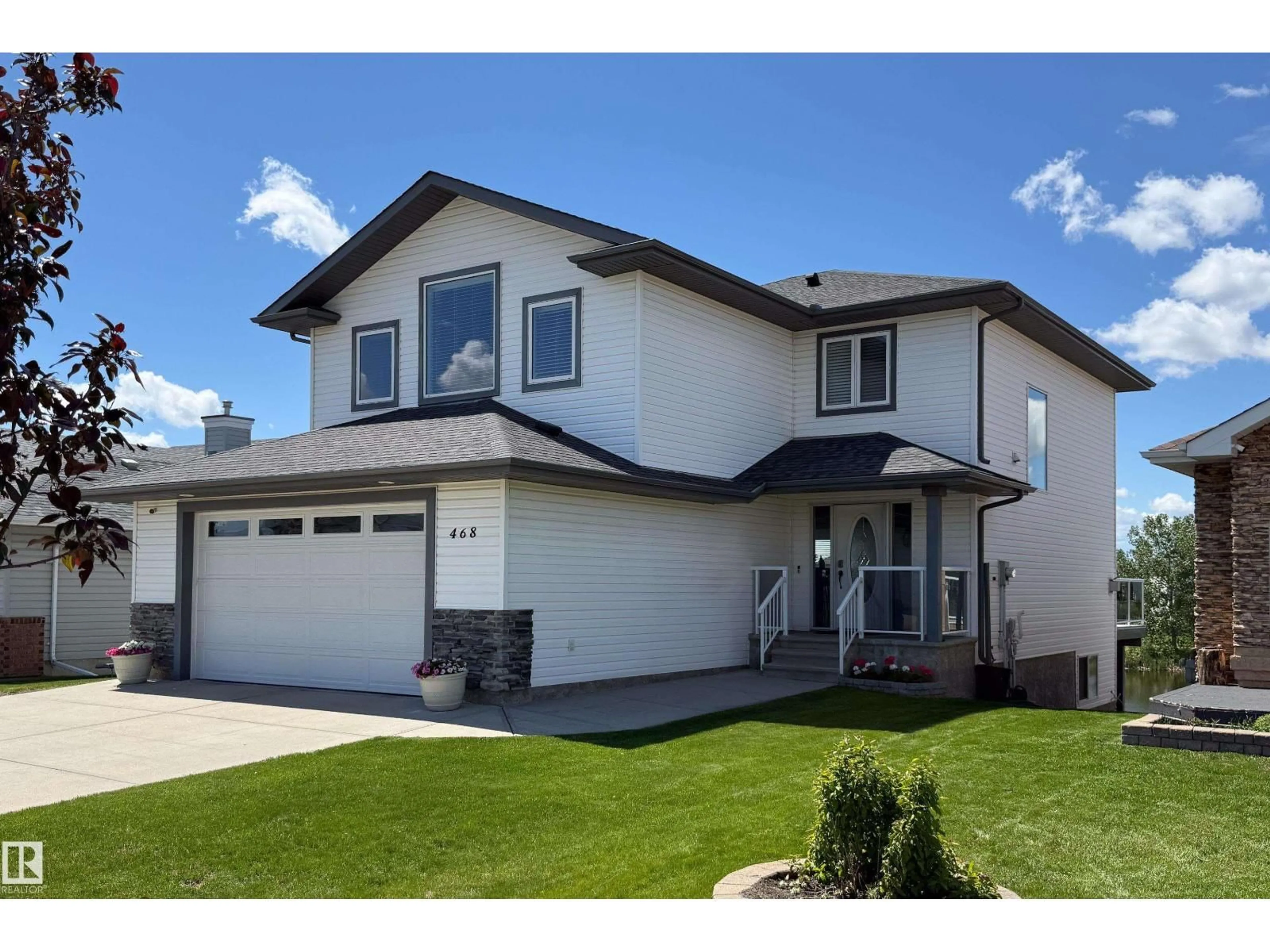 Home with vinyl exterior material, street for NW - 468 KLARVATTEN LAKE WD, Edmonton Alberta T5Z3C2