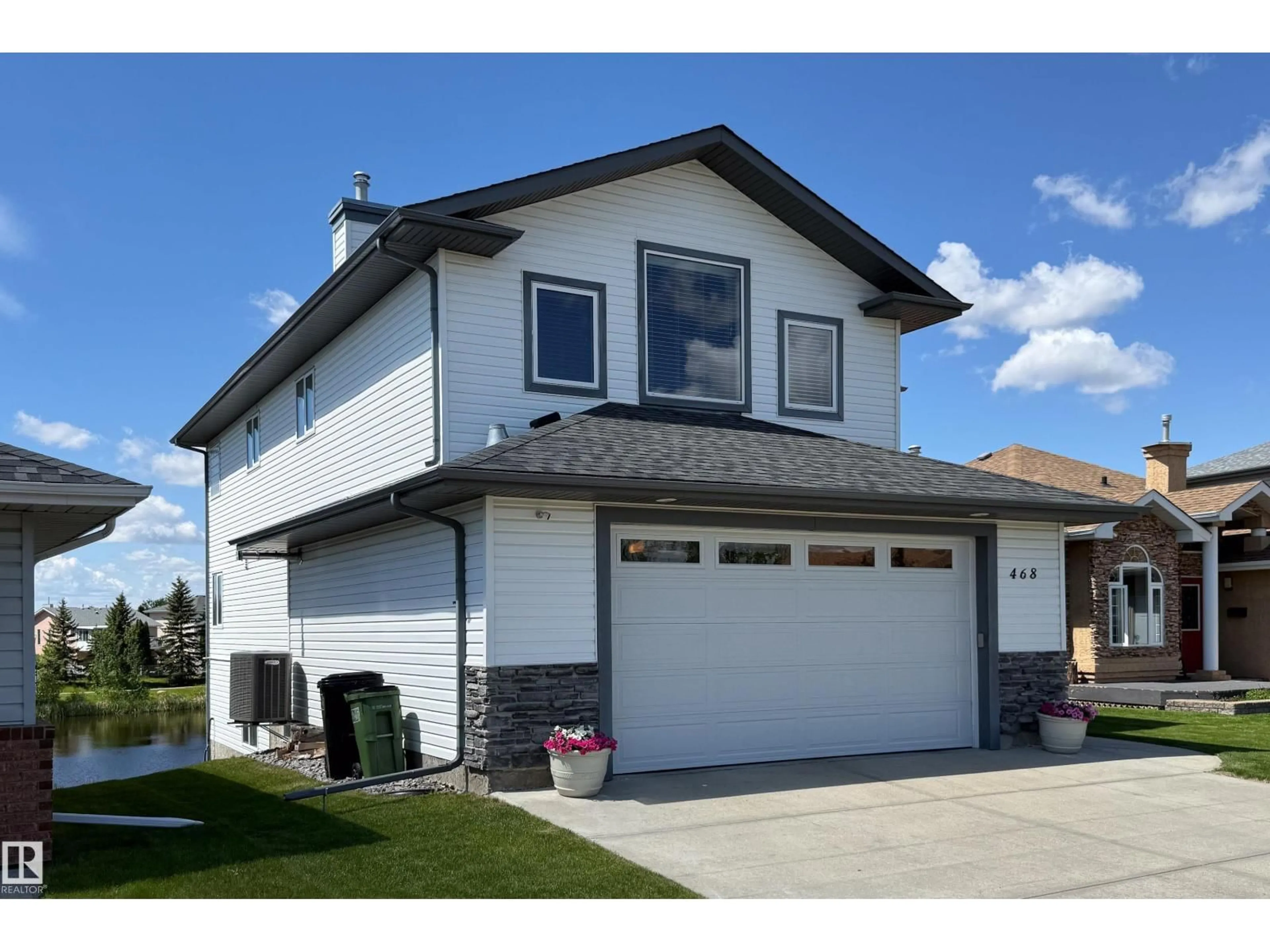 Home with vinyl exterior material, street for NW - 468 KLARVATTEN LAKE WD, Edmonton Alberta T5Z3C2