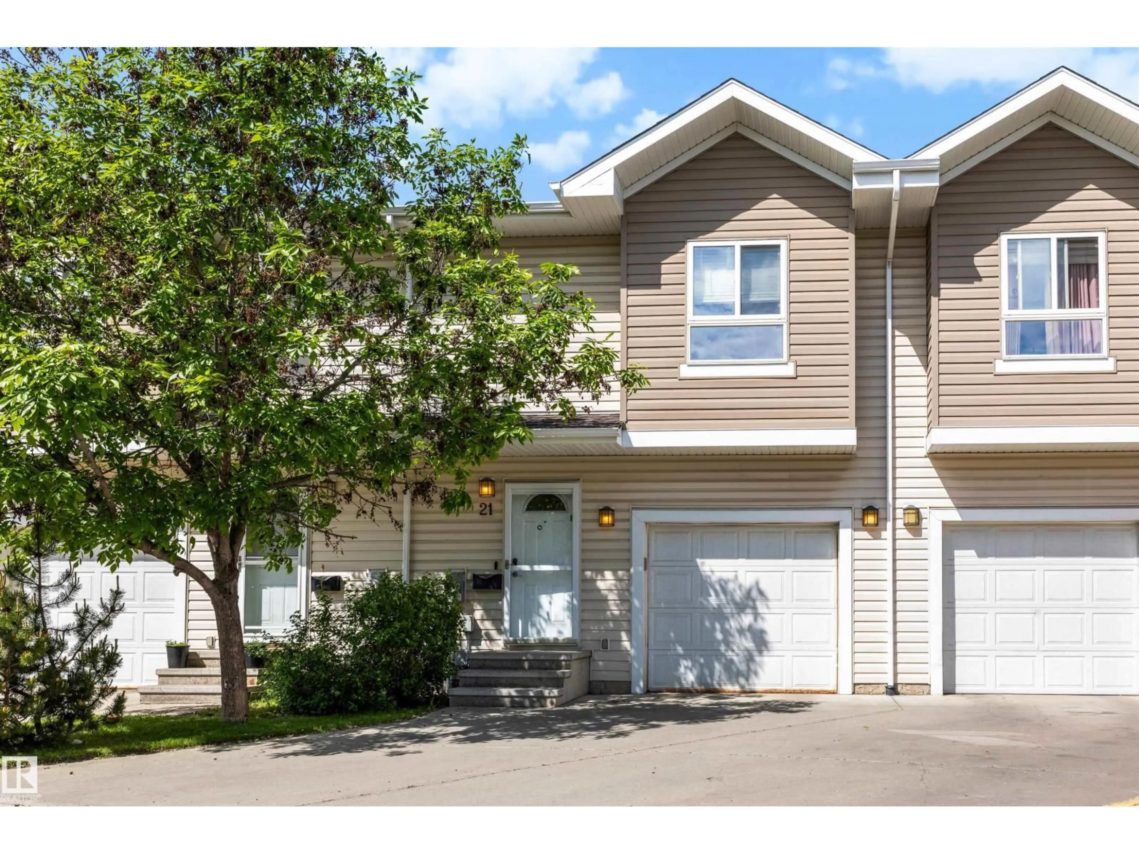 Home with vinyl exterior material, street for #21 - 5120 164 AV, Edmonton Alberta T5Y0L7