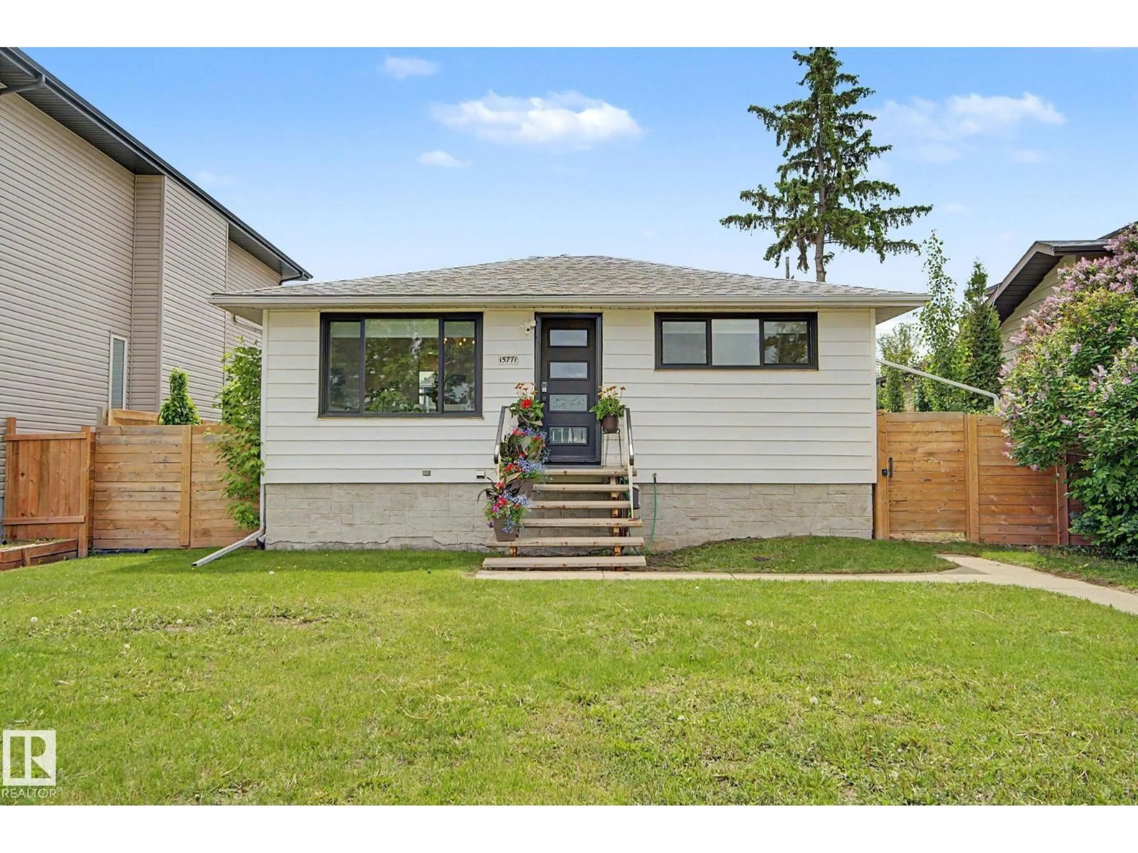 Home with vinyl exterior material, street for 15771 106A AV, Edmonton Alberta T2P0X2