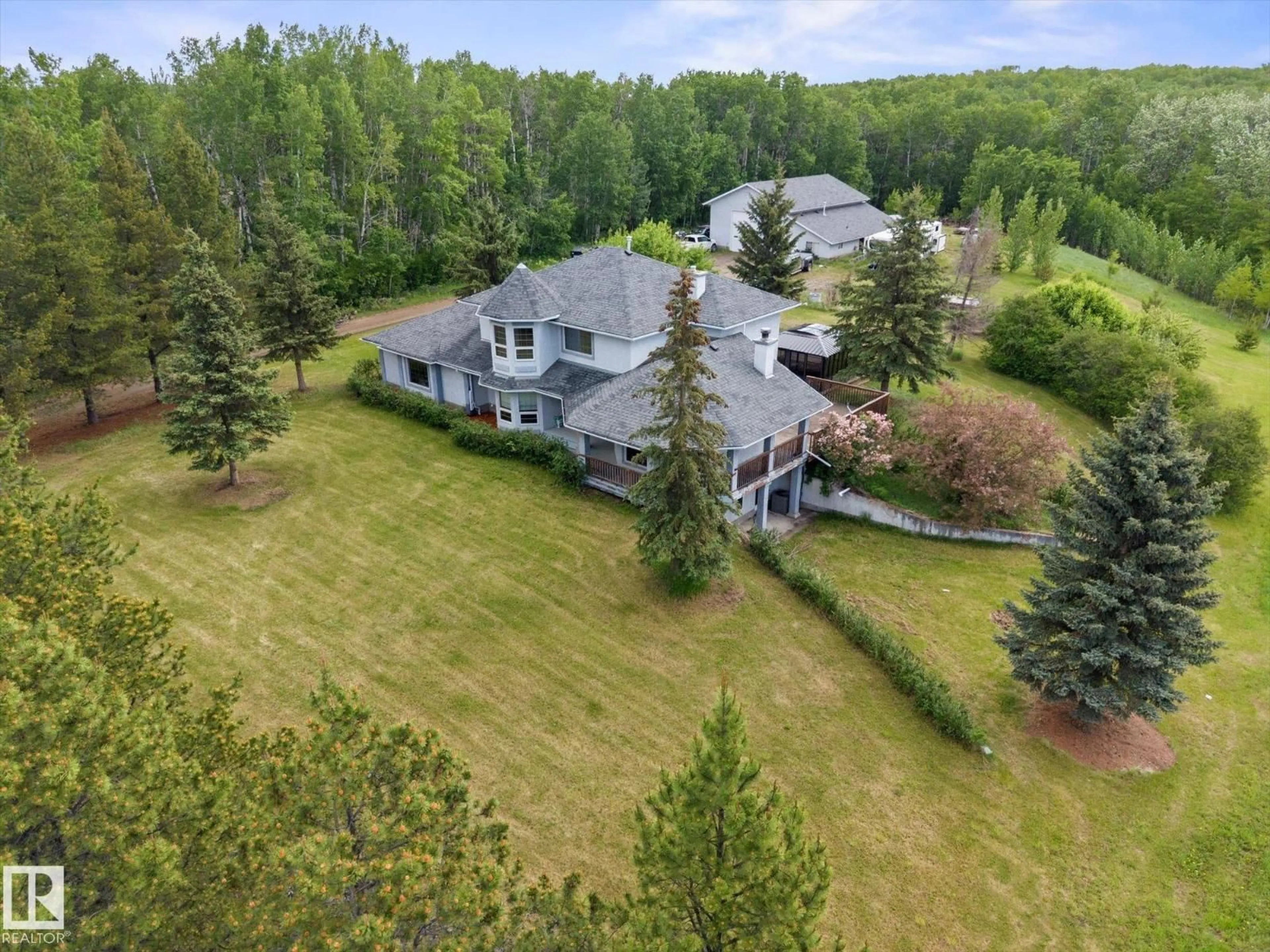 A pic from outside/outdoor area/front of a property/back of a property/a pic from drone, forest/trees view for 53211 RR 13, Rural Parkland County Alberta T7Y0C1