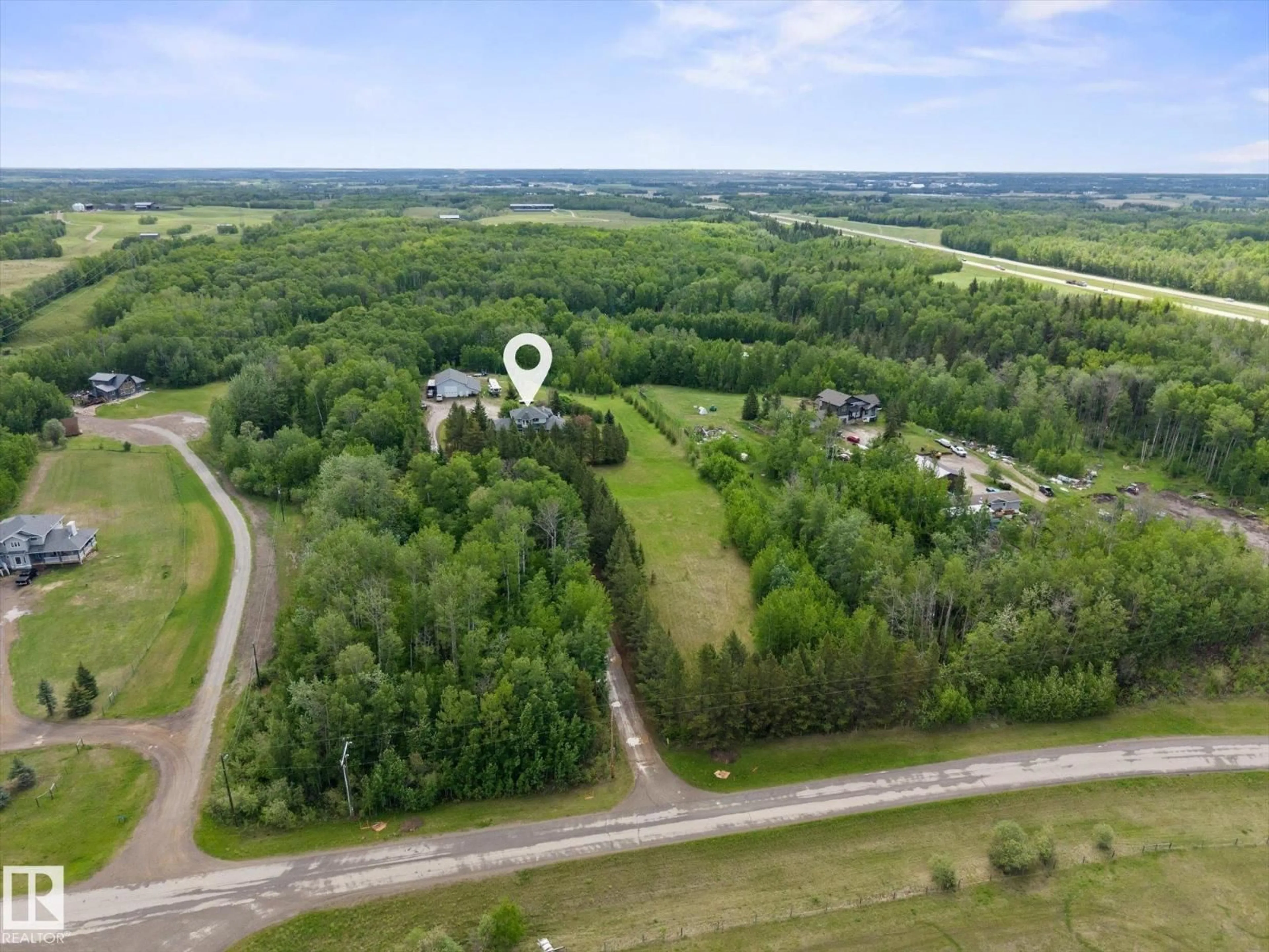 A pic from outside/outdoor area/front of a property/back of a property/a pic from drone, forest/trees view for 53211 RR 13, Rural Parkland County Alberta T7Y0C1