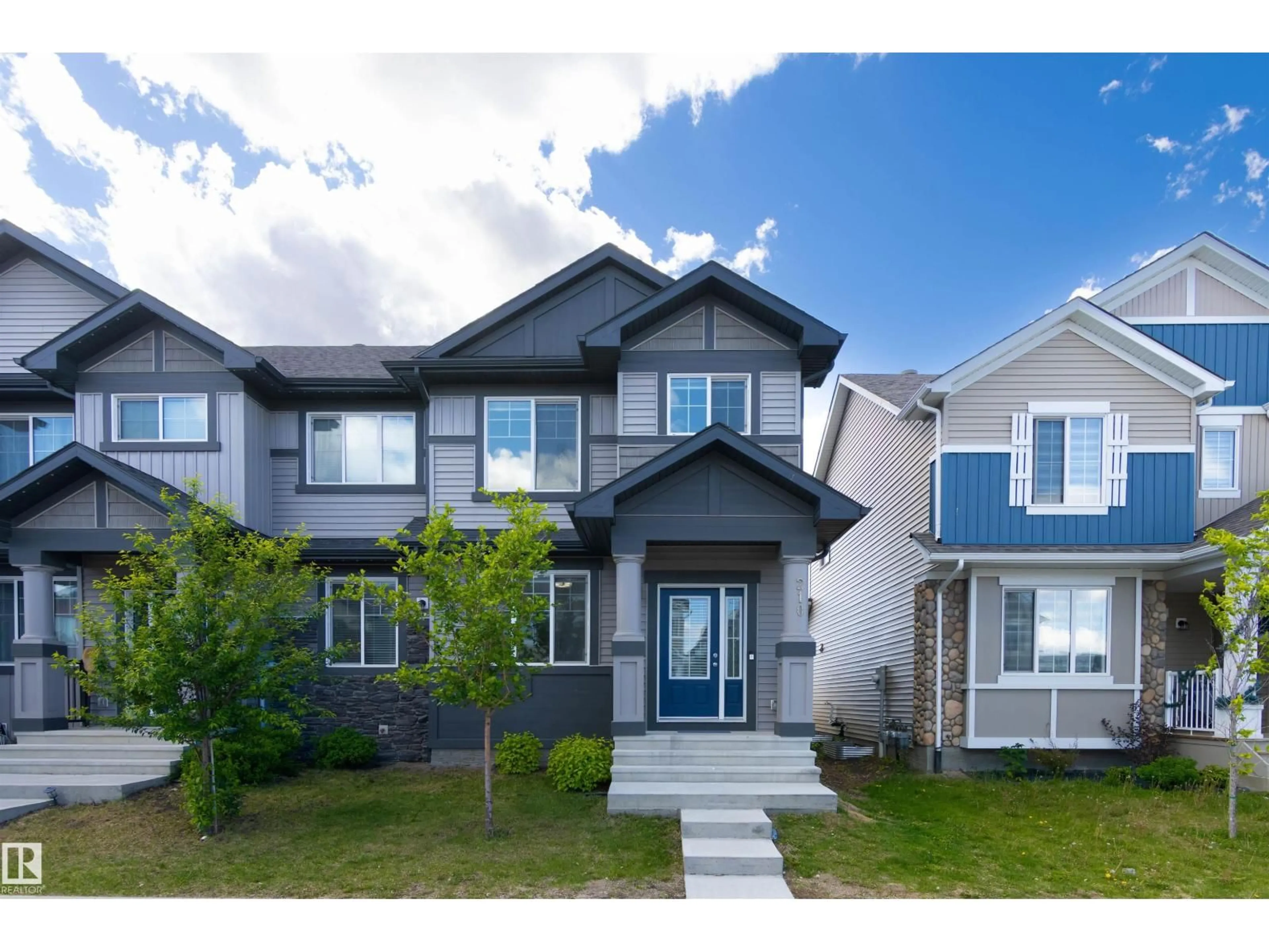 Home with vinyl exterior material, street for 210 DESROCHERS BV, Edmonton Alberta T6W4N2