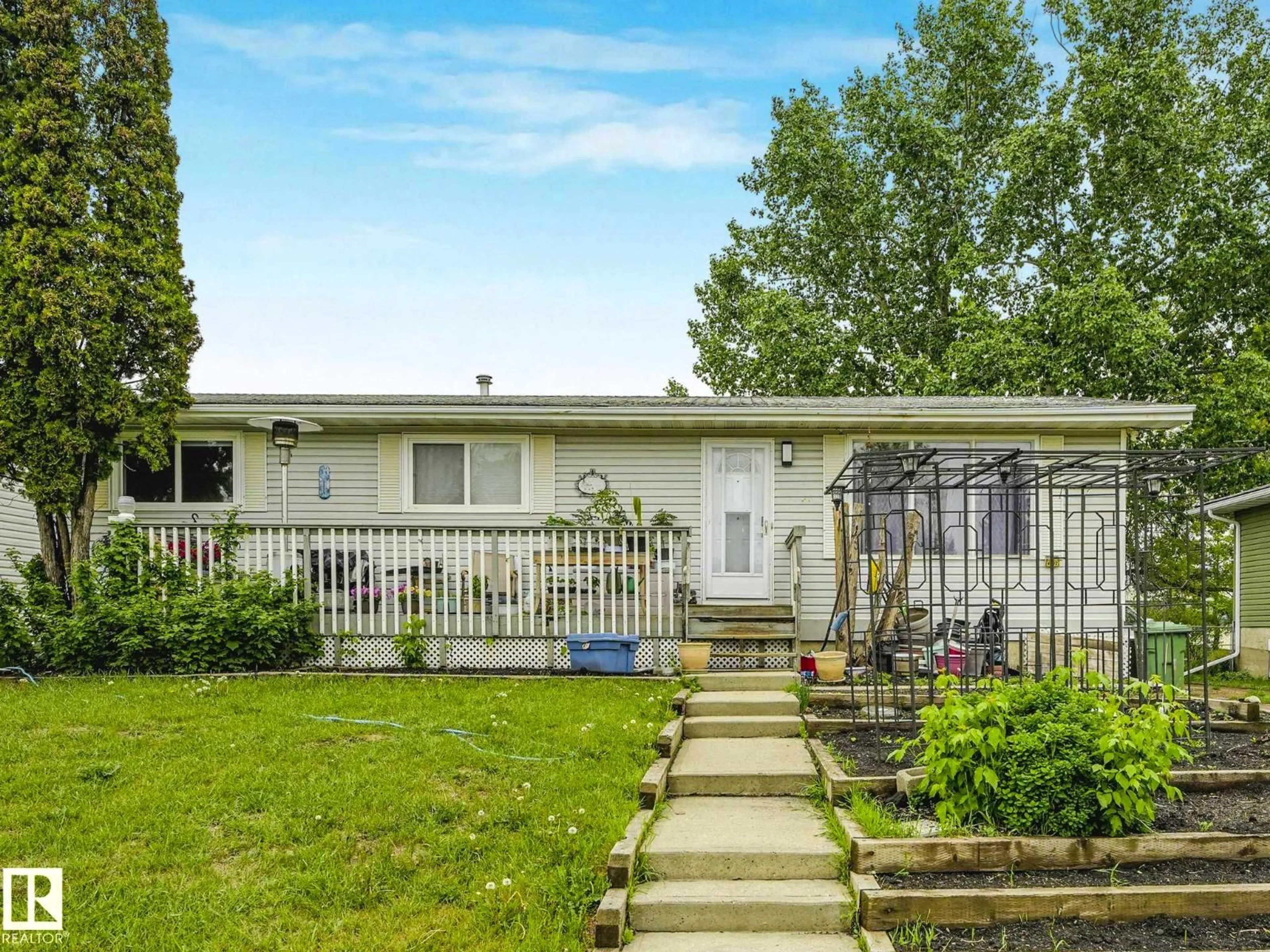 Home with vinyl exterior material, street for 4902 52 AV, Beaumont Alberta T4X1H6