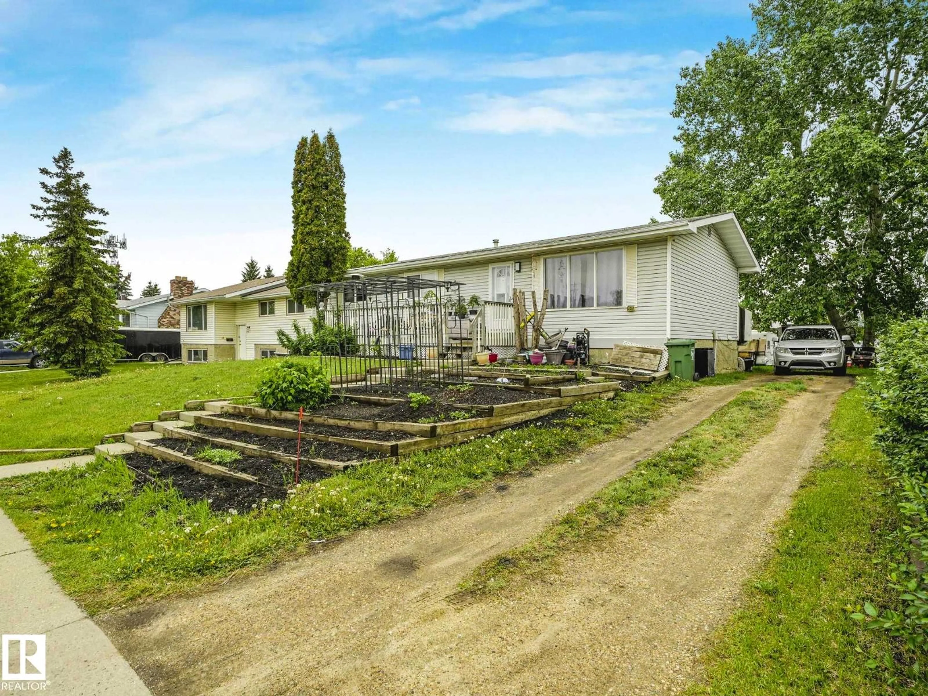 A pic from outside/outdoor area/front of a property/back of a property/a pic from drone, street for 4902 52 AV, Beaumont Alberta T4X1H6