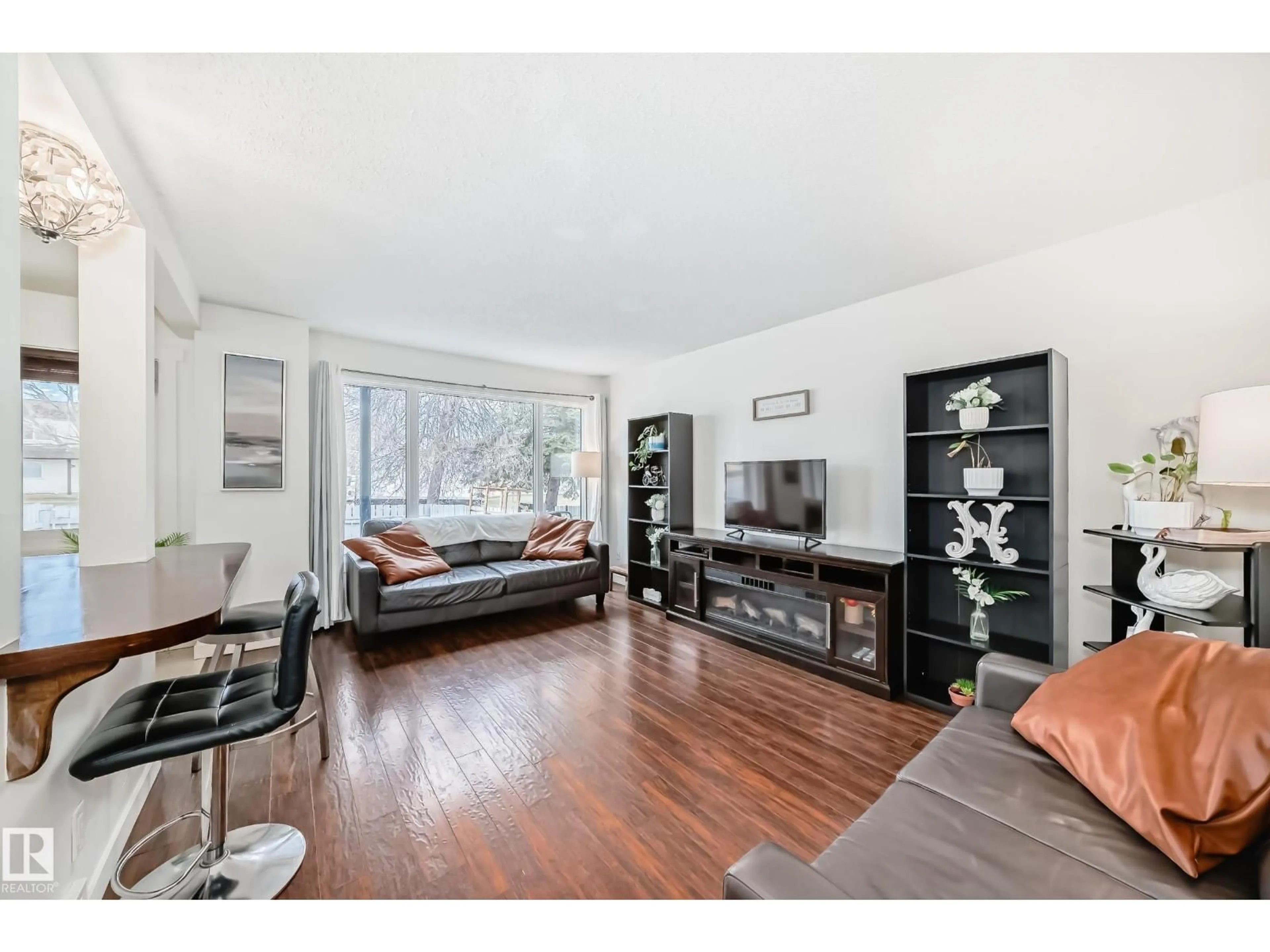 Living room with furniture, wood/laminate floor for 75 AMBERLY CT, Edmonton Alberta T5A2N9