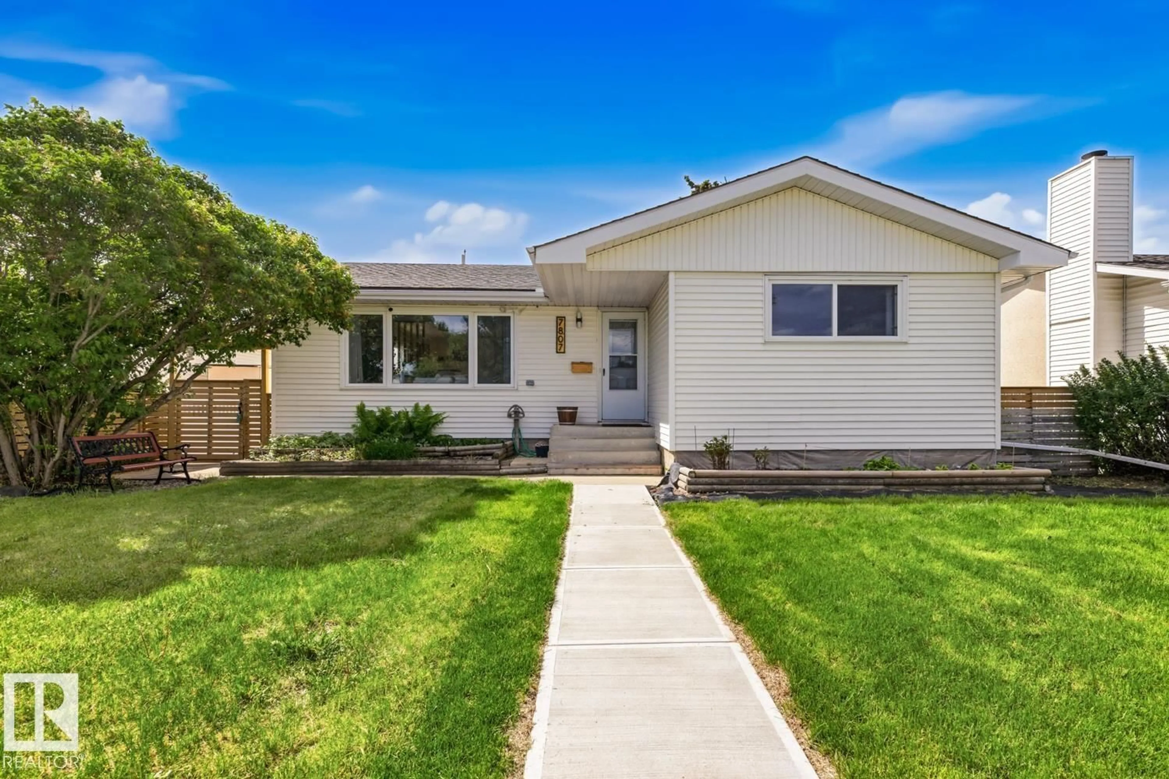 Home with vinyl exterior material, street for 7807 132 AV, Edmonton Alberta T5C2B2