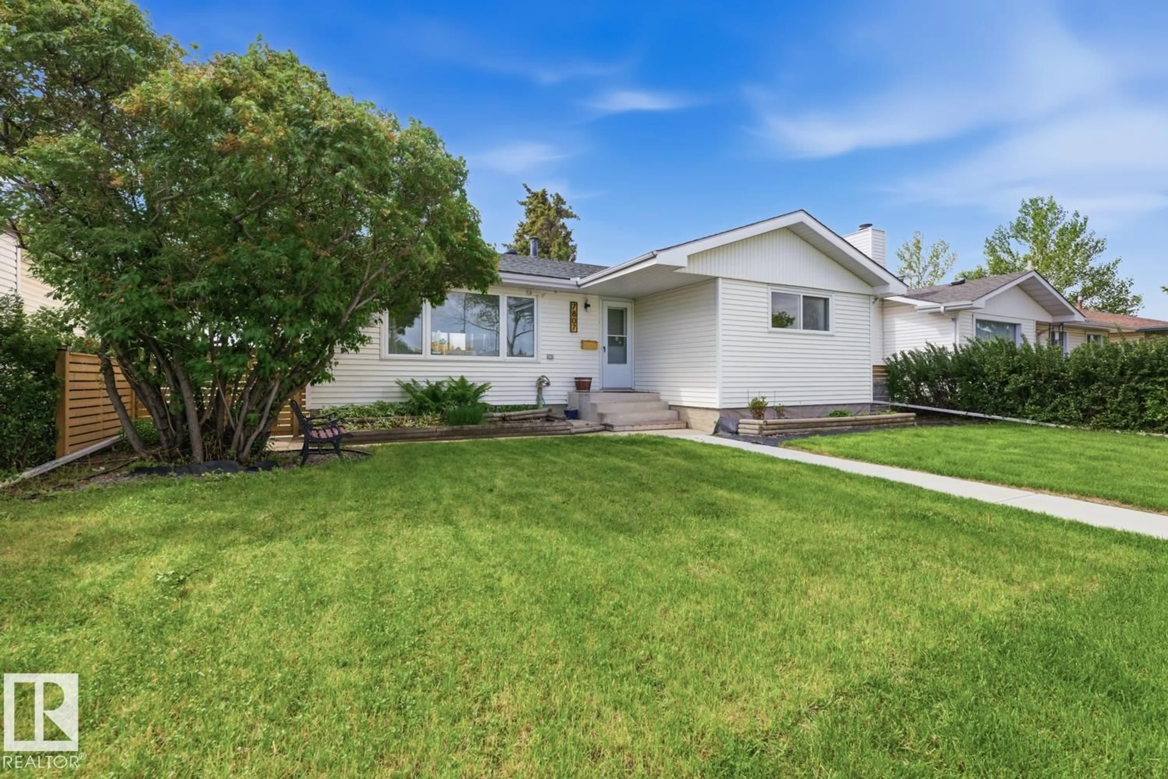 Home with vinyl exterior material, street for 7807 132 AV, Edmonton Alberta T5C2B2