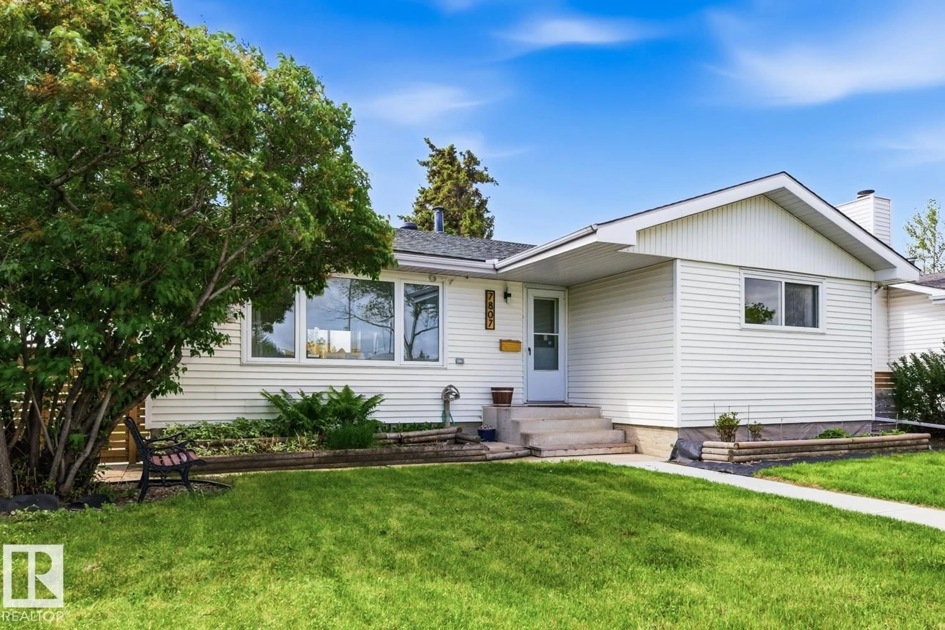 Home with vinyl exterior material, street for 7807 132 AV, Edmonton Alberta T5C2B2