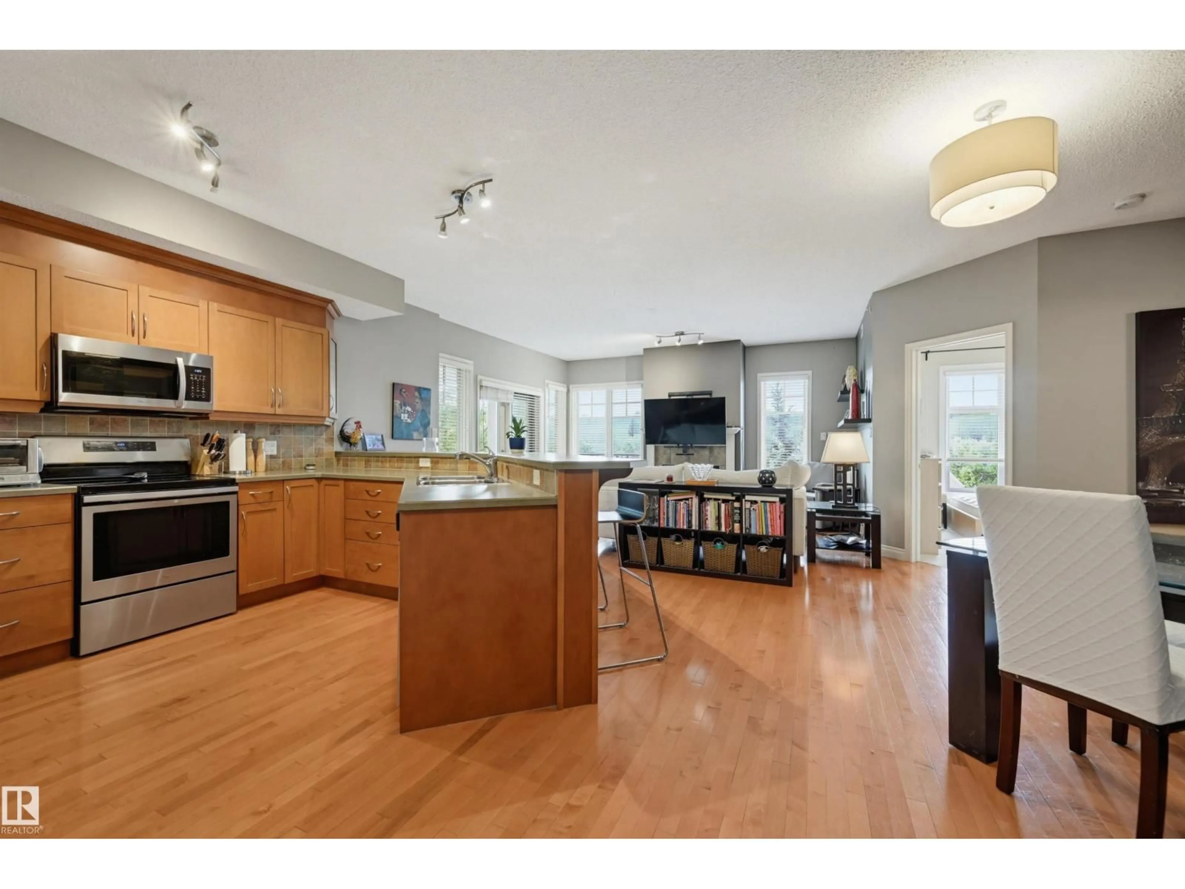 Open concept kitchen, wood/laminate floor for #409 - 9811 96A ST, Edmonton Alberta T6A4A4