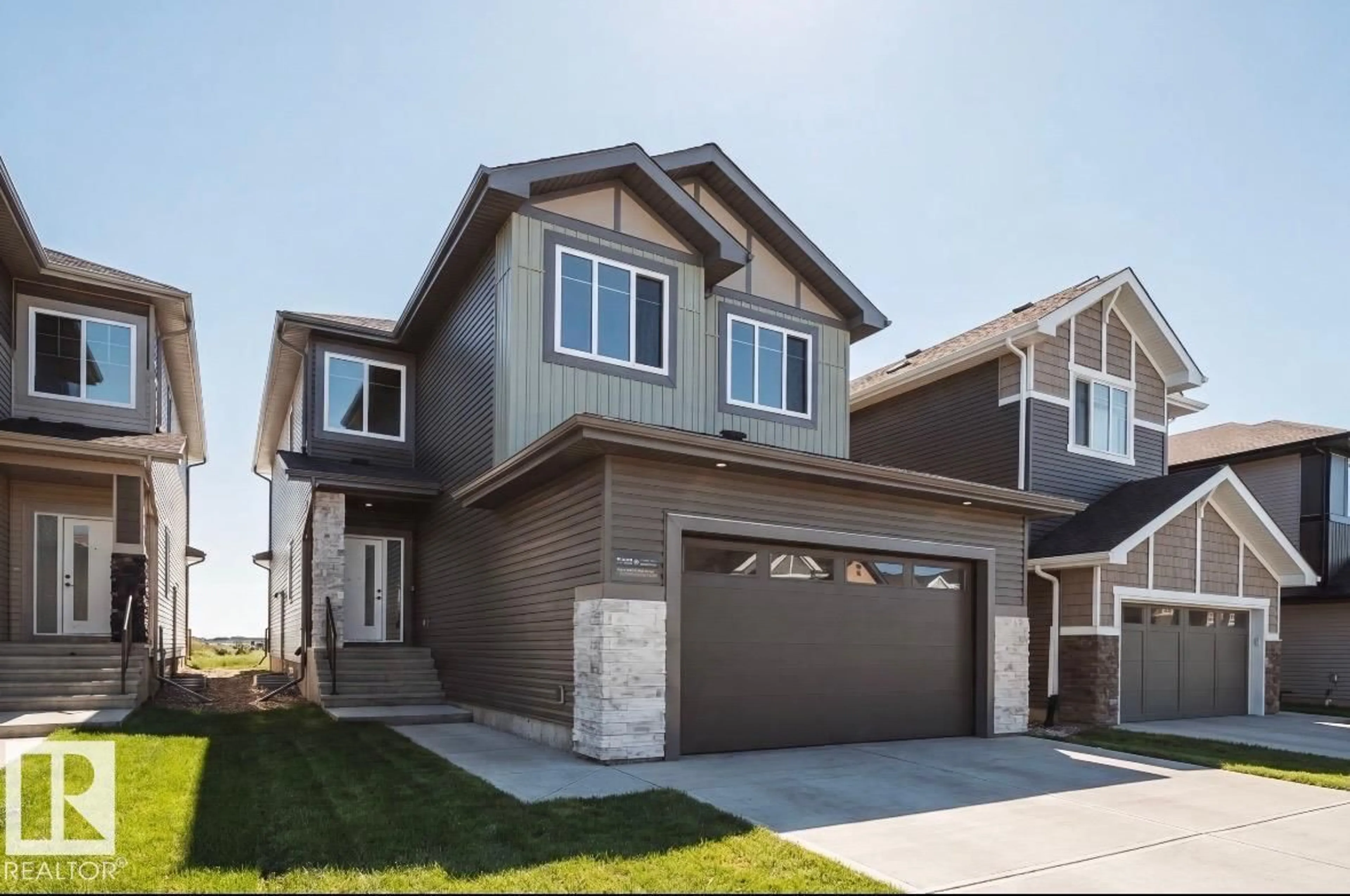 Home with vinyl exterior material, street for NW - 7027 177 AV, Edmonton Alberta T5Z0W9