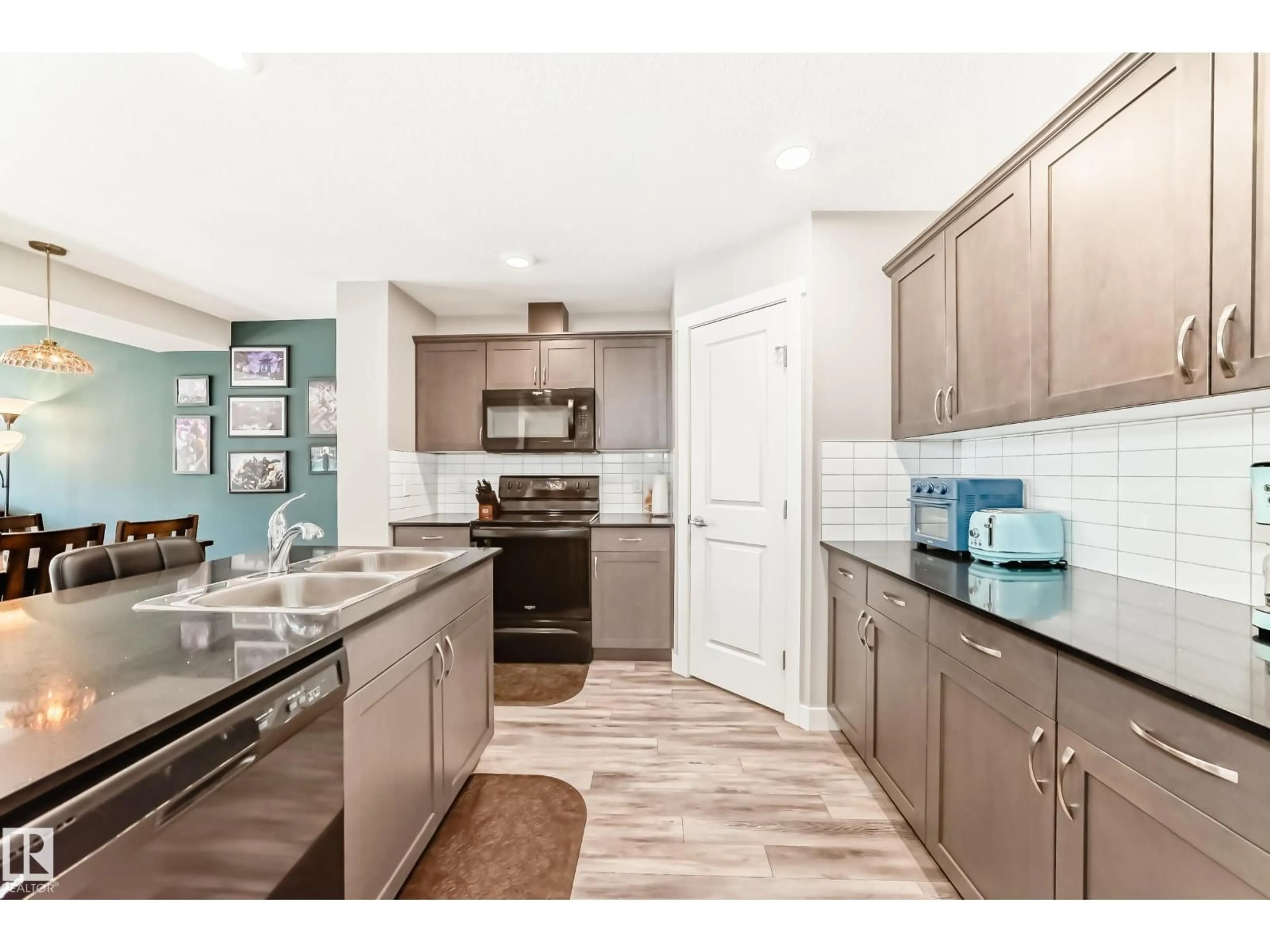 Open concept kitchen, ceramic/tile floor for #108 - 17832 78 ST, Edmonton Alberta T5Z0L7