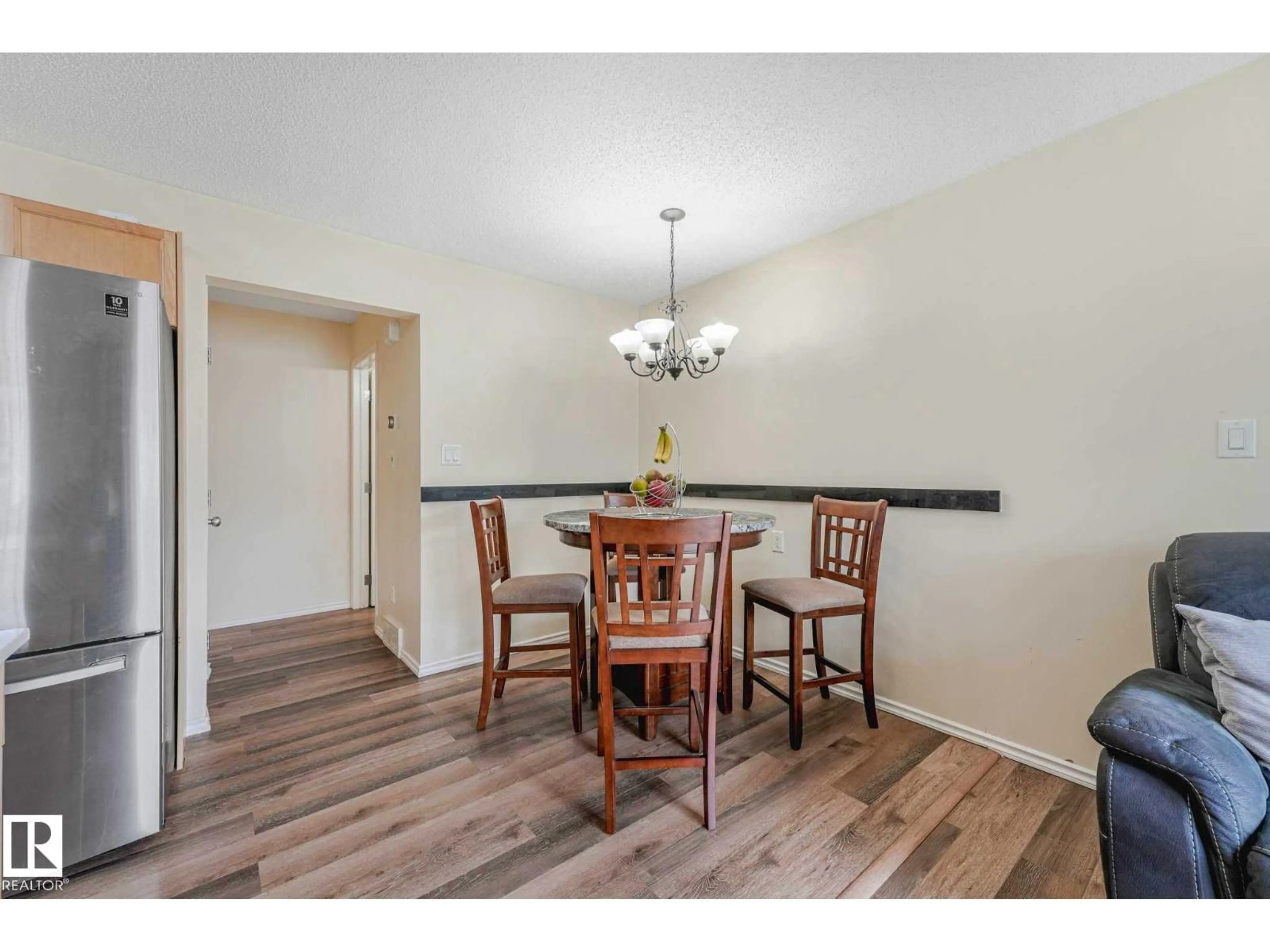 Dining room, wood/laminate floor for 451 - 56 HYNDMAN CR, Edmonton Alberta T5A5J3