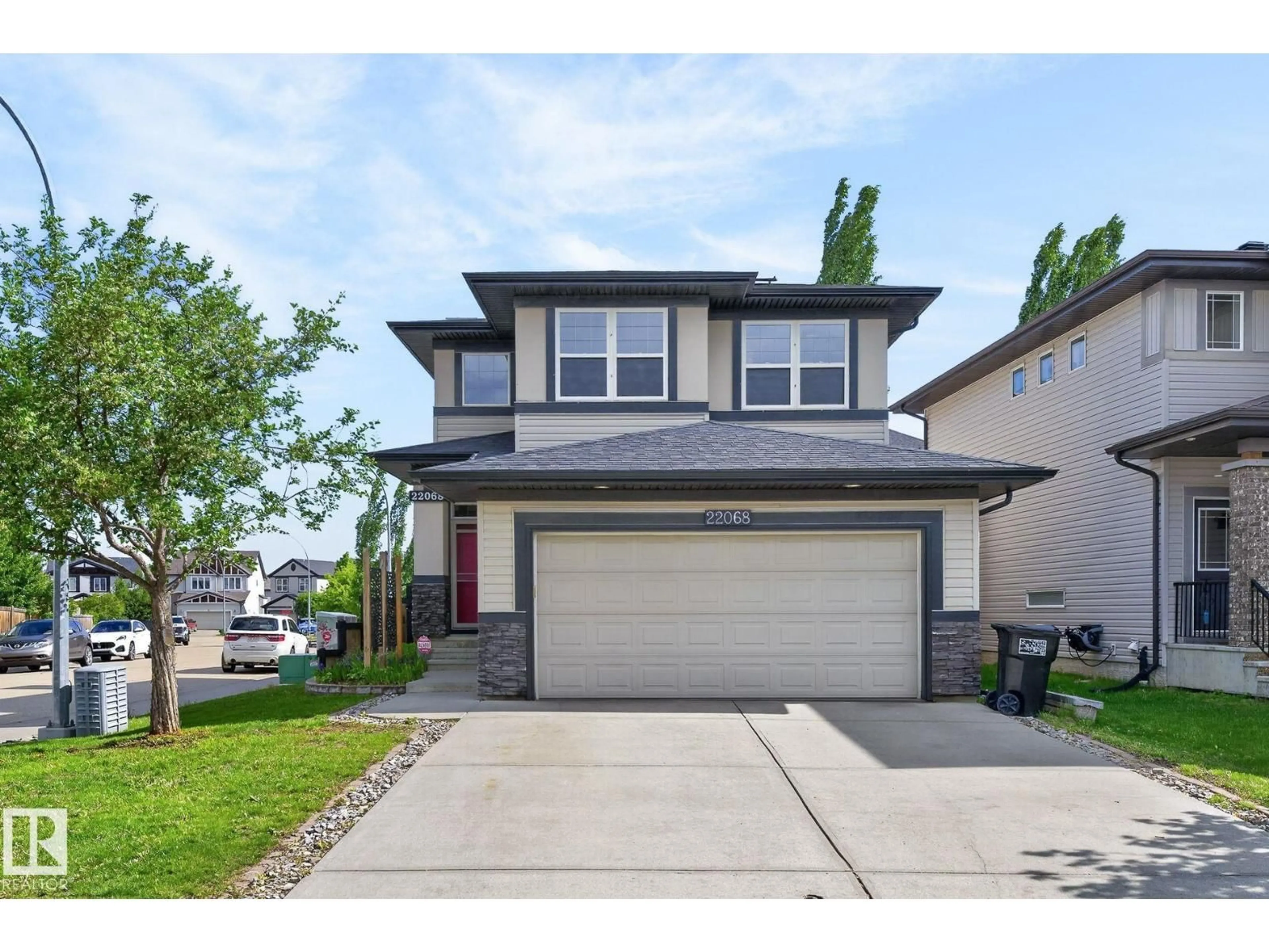 Home with vinyl exterior material, street for 22068 95 AV, Edmonton Alberta T5T4A8