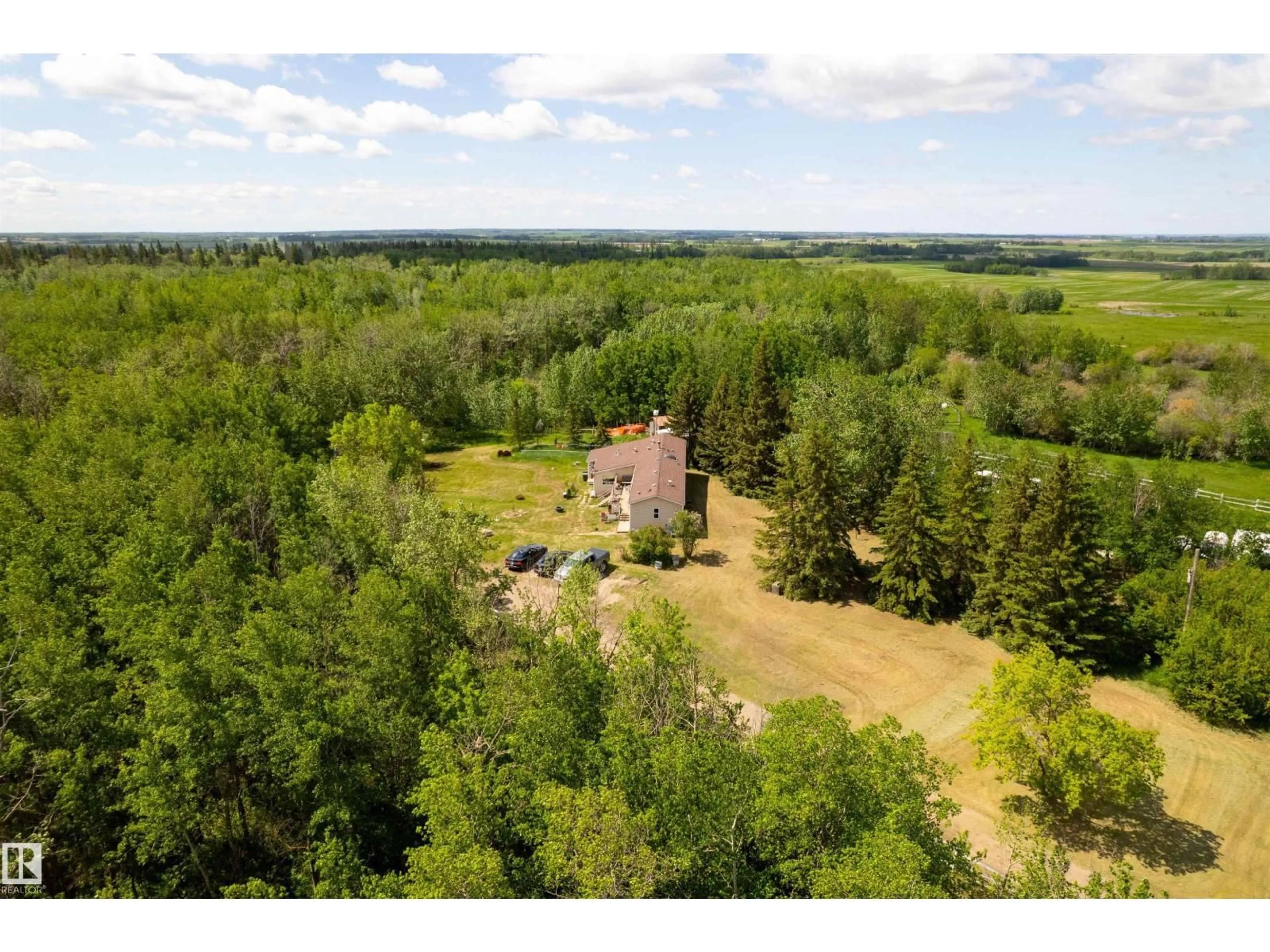 A pic from outside/outdoor area/front of a property/back of a property/a pic from drone, forest/trees view for 20519 TWP ROAD 550, Rural Strathcona County Alberta T8L4B6
