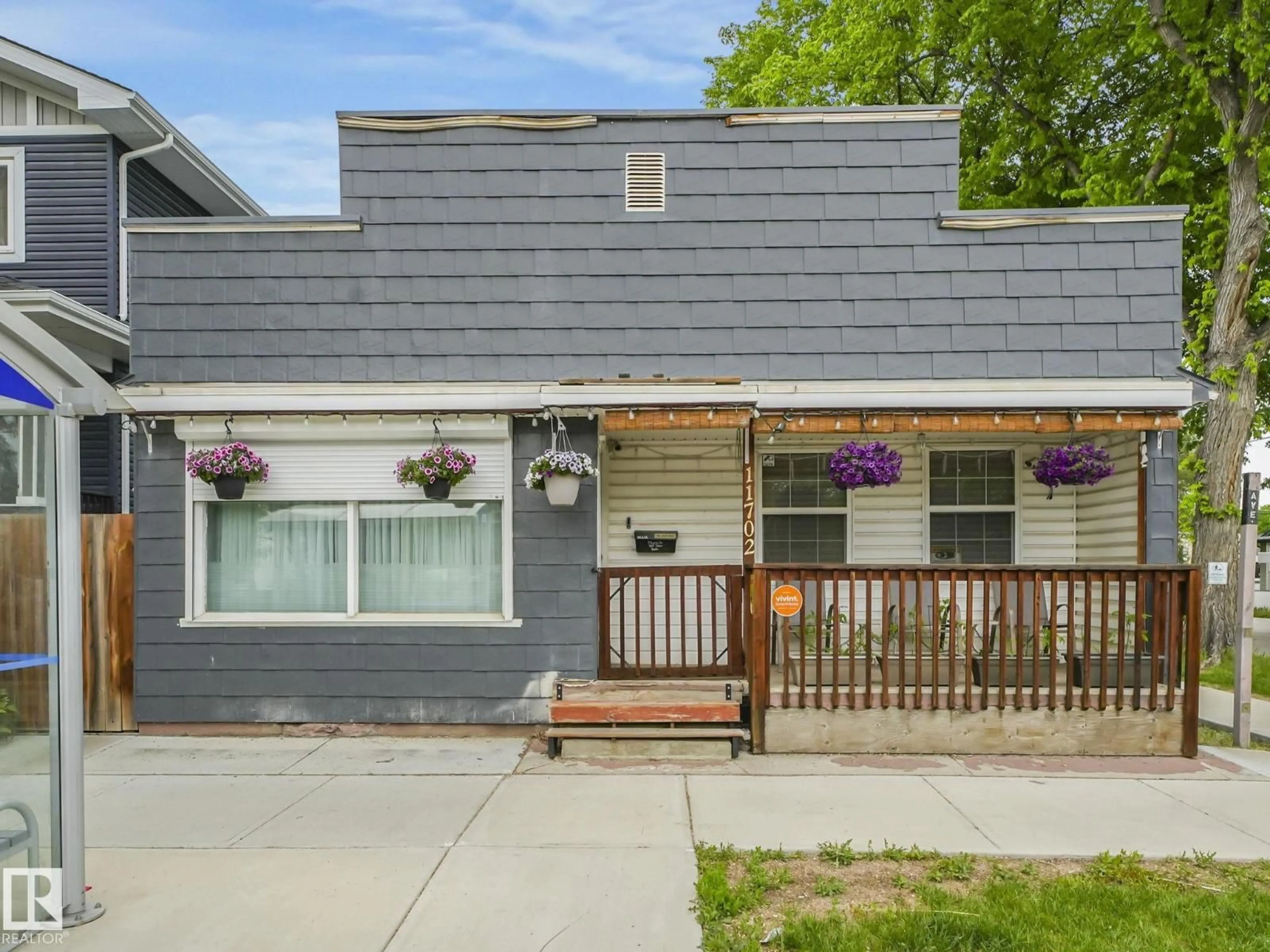 Home with vinyl exterior material, street for 11702 129 AV, Edmonton Alberta T5E0M8