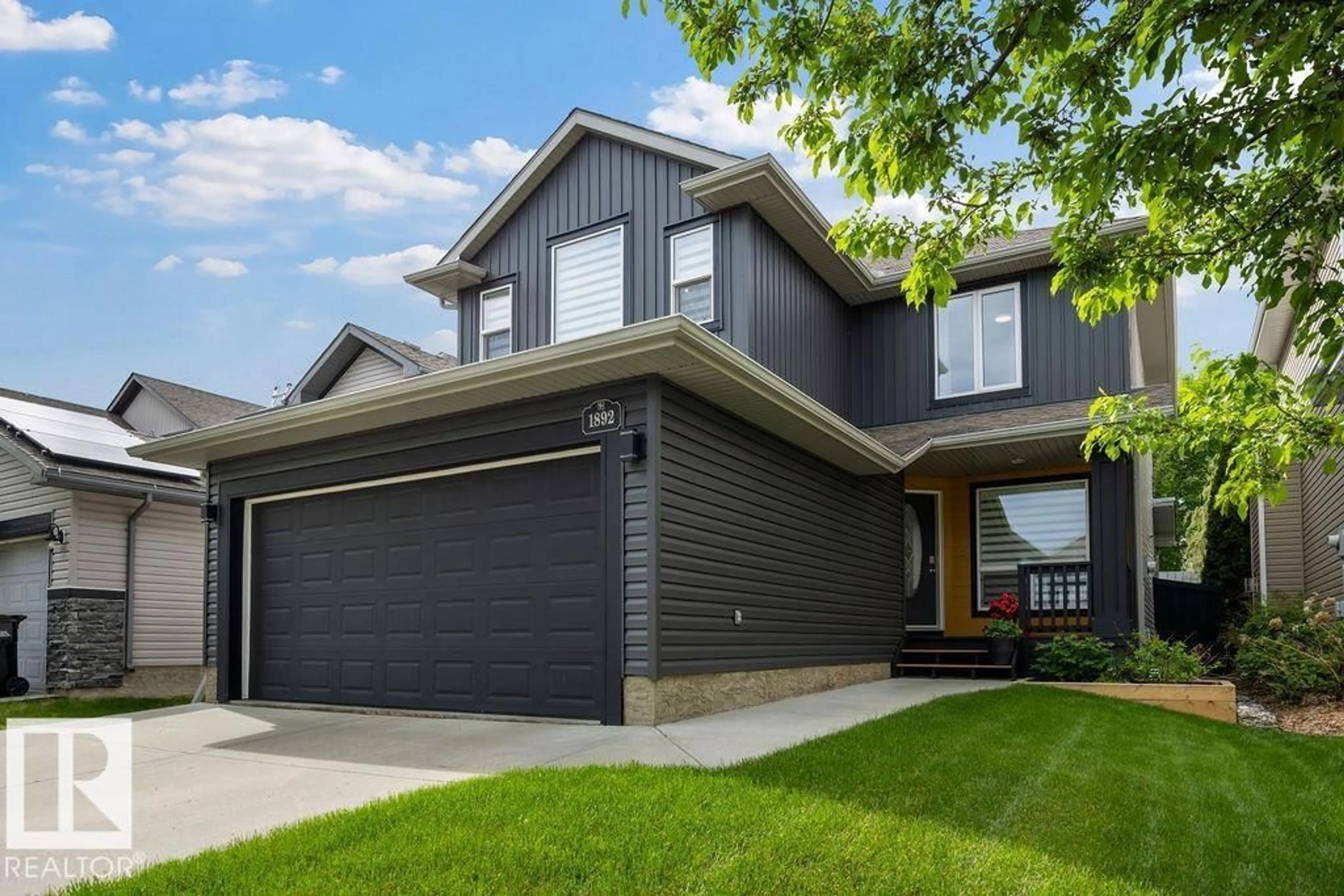 Home with vinyl exterior material, street for 1892 ROBERTSON CR, Edmonton Alberta T6W1N8