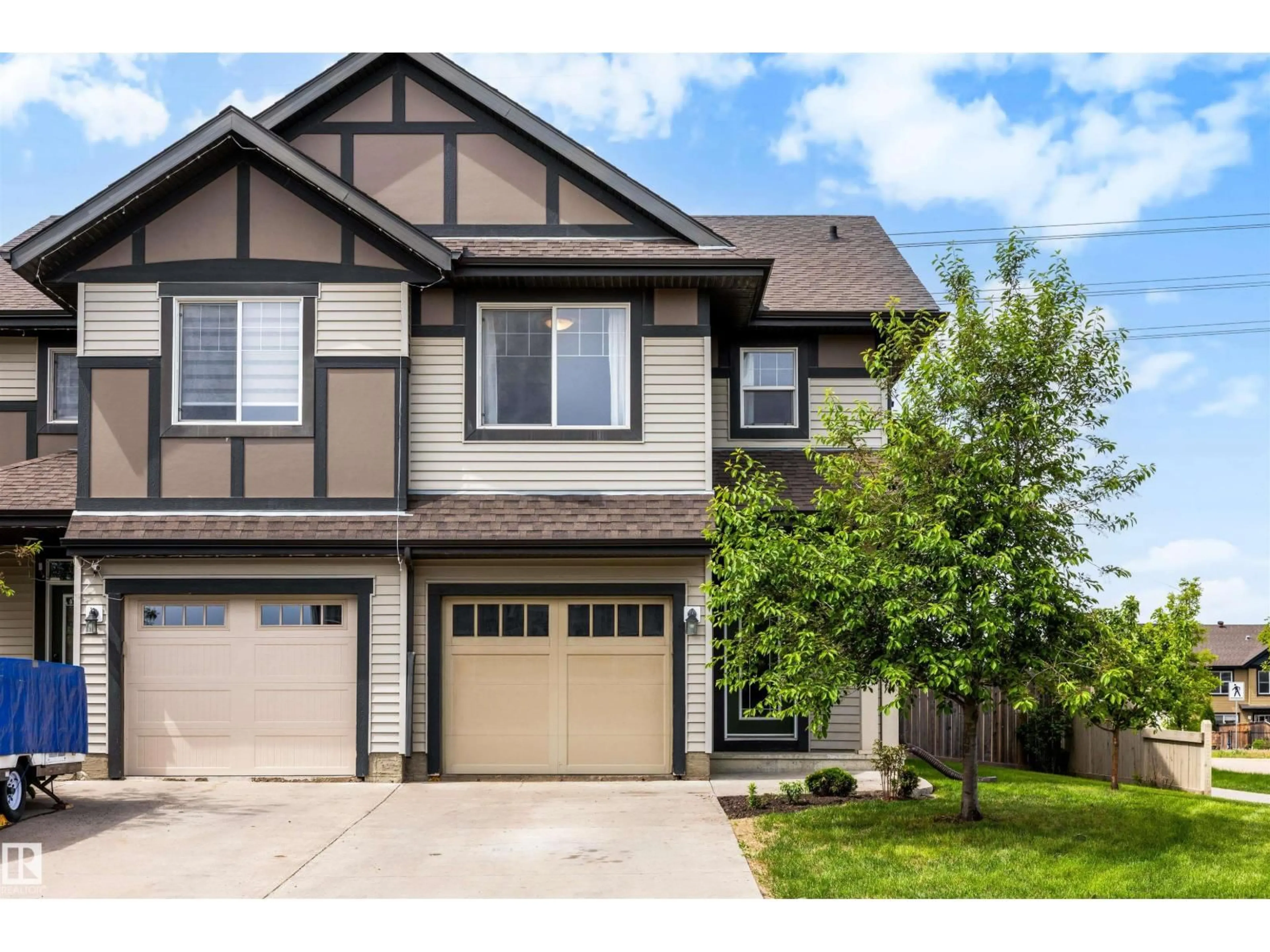 Home with vinyl exterior material, street for 2097 CHALMERS WY, Edmonton Alberta T6W2E9